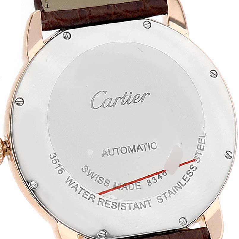 The image shows the back of a Cartier Ronde W6701009 Men's Rose Gold Silver Dial watch, highlighting its case back and details like "Automatic" and "Swiss Made."