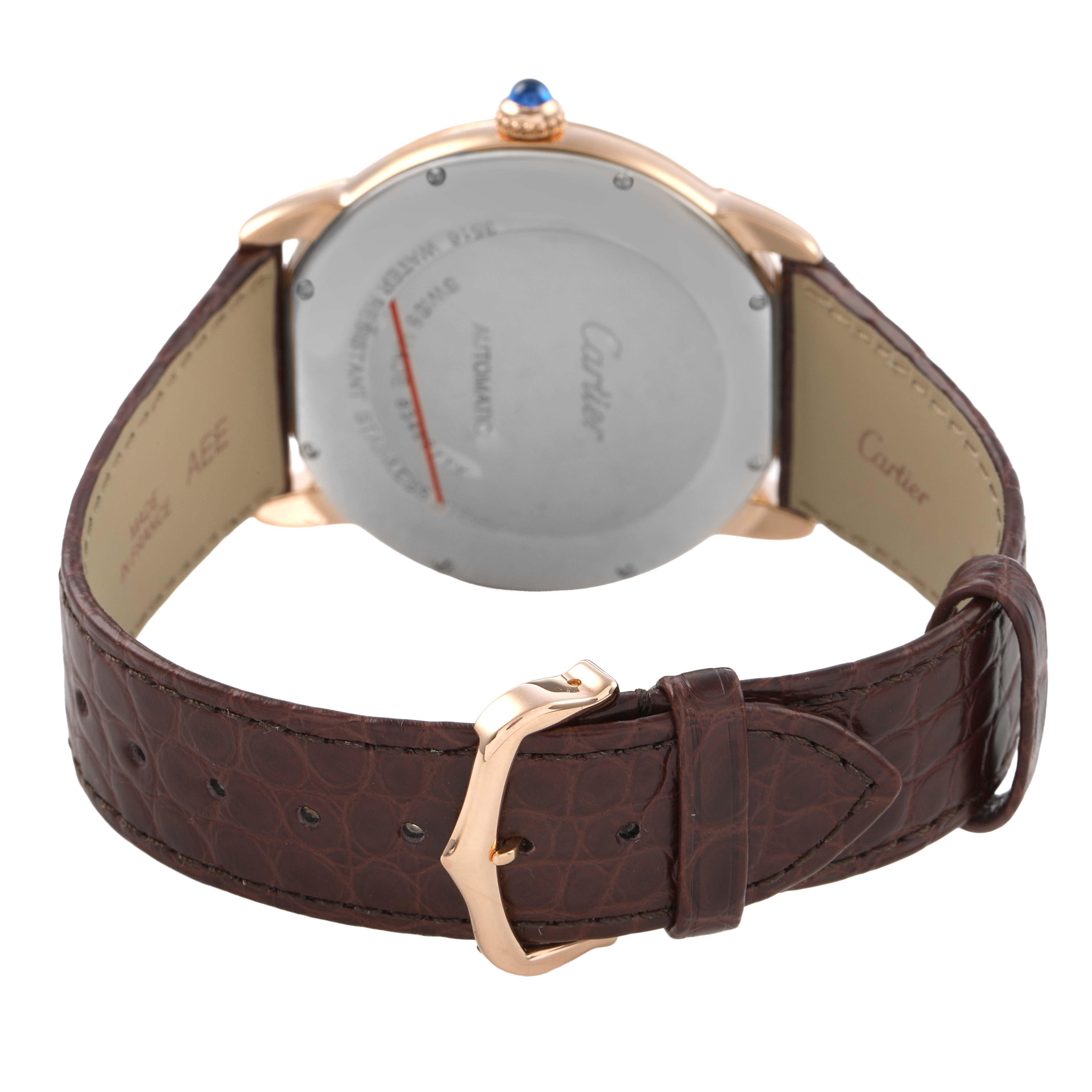 The image shows the back view of a Cartier Ronde W6701009 Men's Rose Gold Silver Dial watch, highlighting the case back, crown, and leather strap with a buckle.