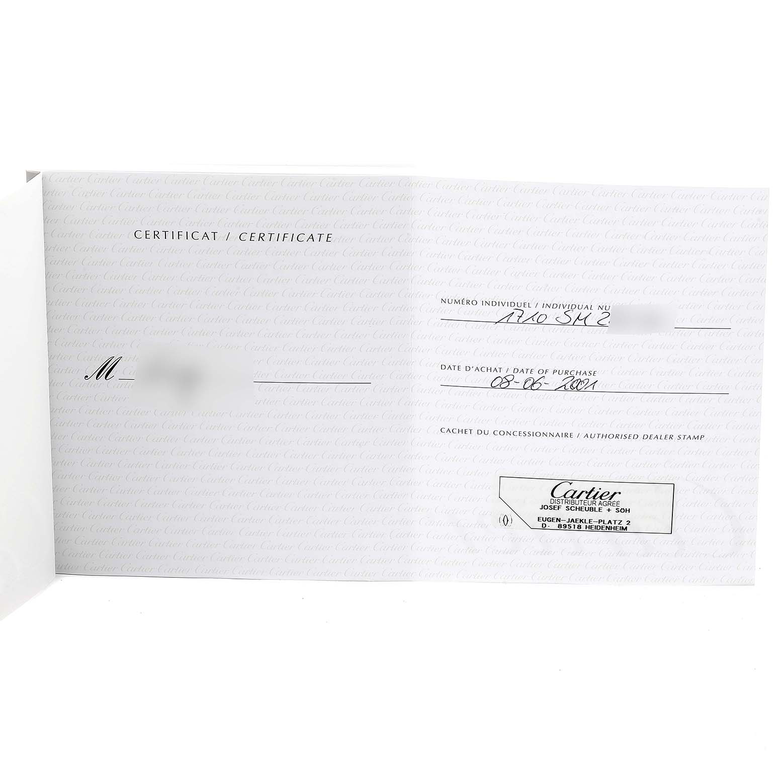 This shows the authenticity certificate for the Cartier Tank Américaine watch, including purchase date and dealer stamp.