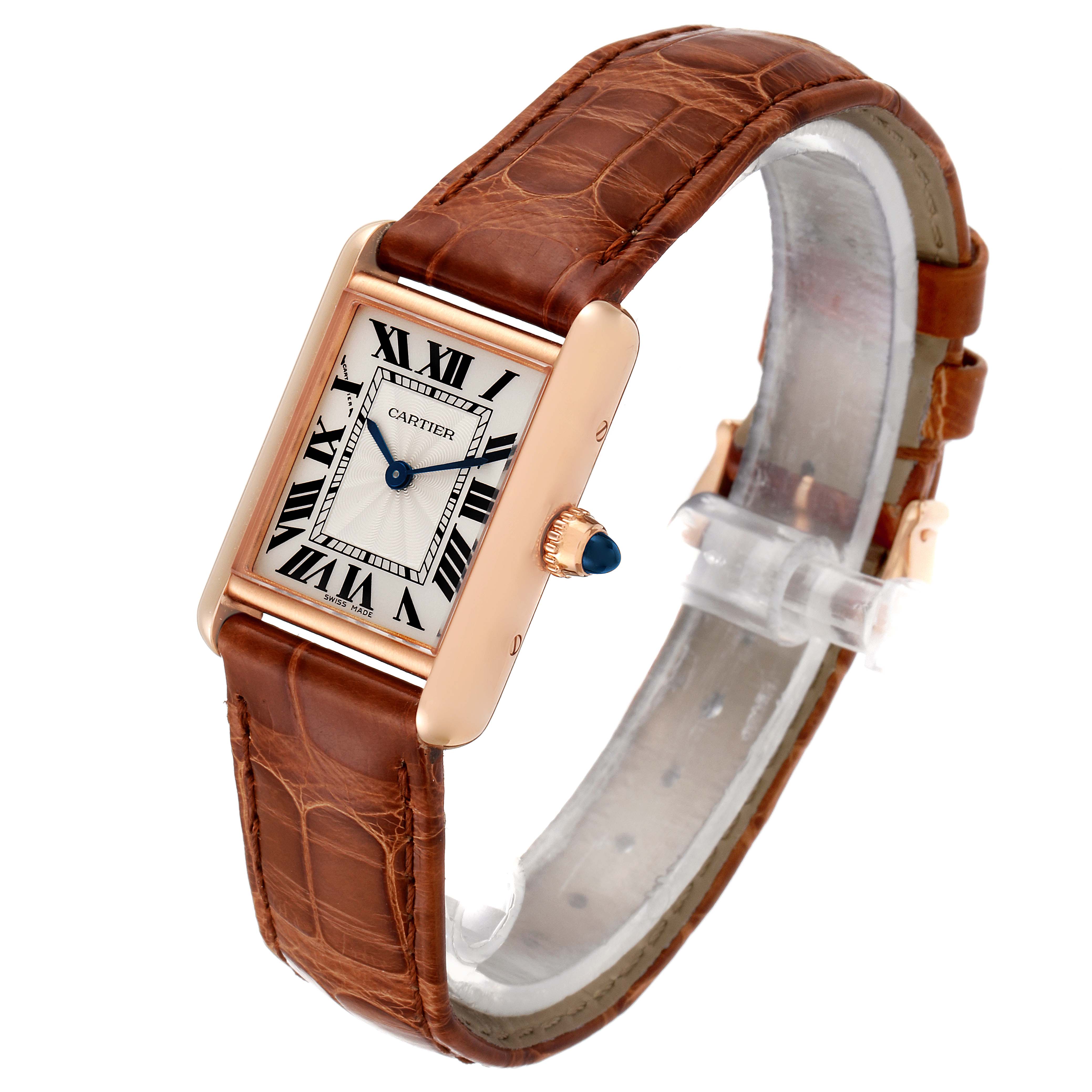The image shows a Cartier Tank Louis WGTA0010  Women's Rose Gold Silver Dial WGTA0010  Women's Rose Gold Silver Dial watch from a three-quarter angle, highlighting the face, brown leather strap, and blue cabochon crown.