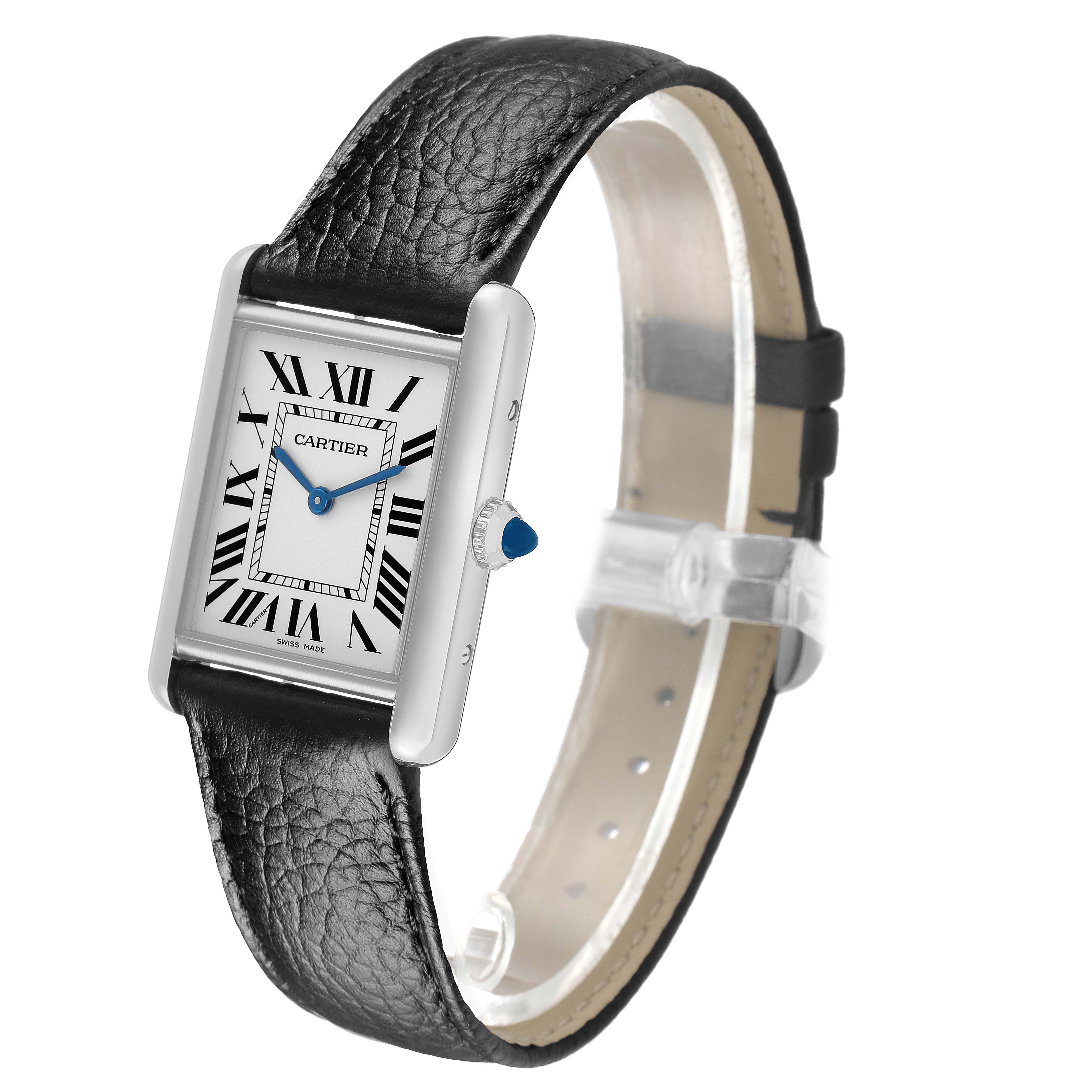 The Tank Must by Cartier is shown in a three-quarter view, highlighting the face, leather strap, and side profile.