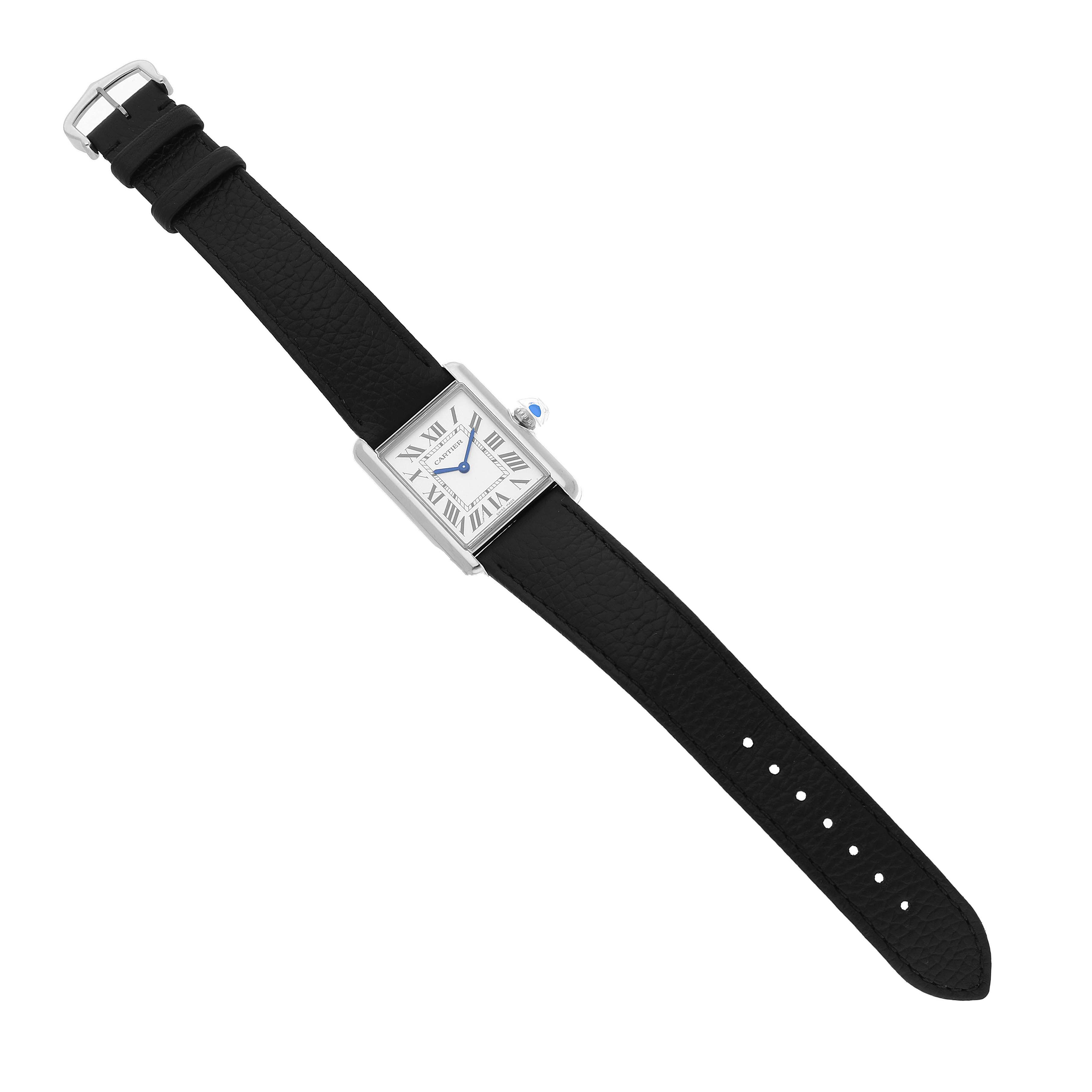The Cartier Tank Must WSTA0109 Men's Stainless Steel Silver Dial watch is shown in a top-view angle, displaying the black strap, rectangular face, and blue hands.