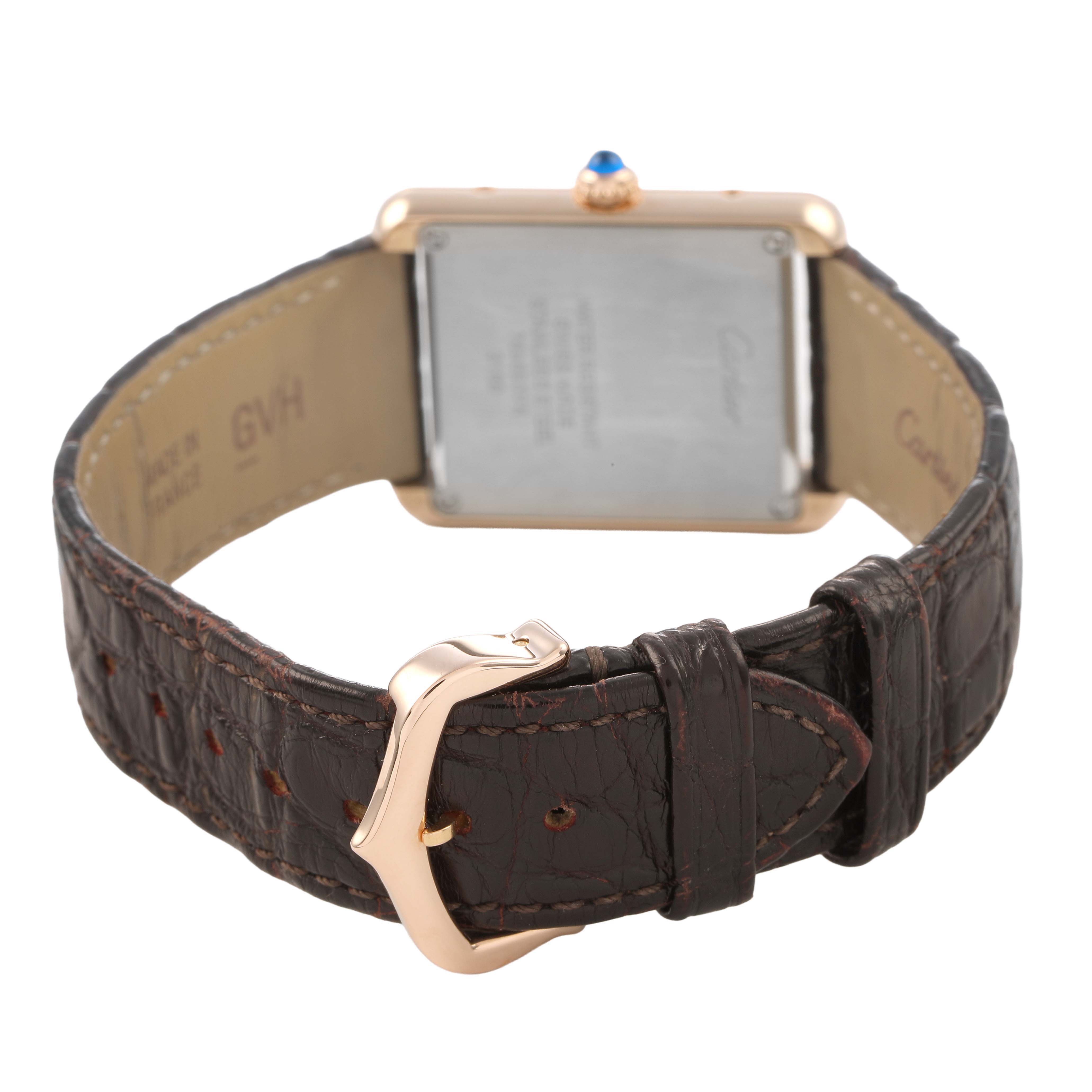 The Cartier Tank Solo W5200002 Women's Yellow Gold Silver Dial watch is shown from the back, highlighting the leather strap and rectangular case with the crown visible.