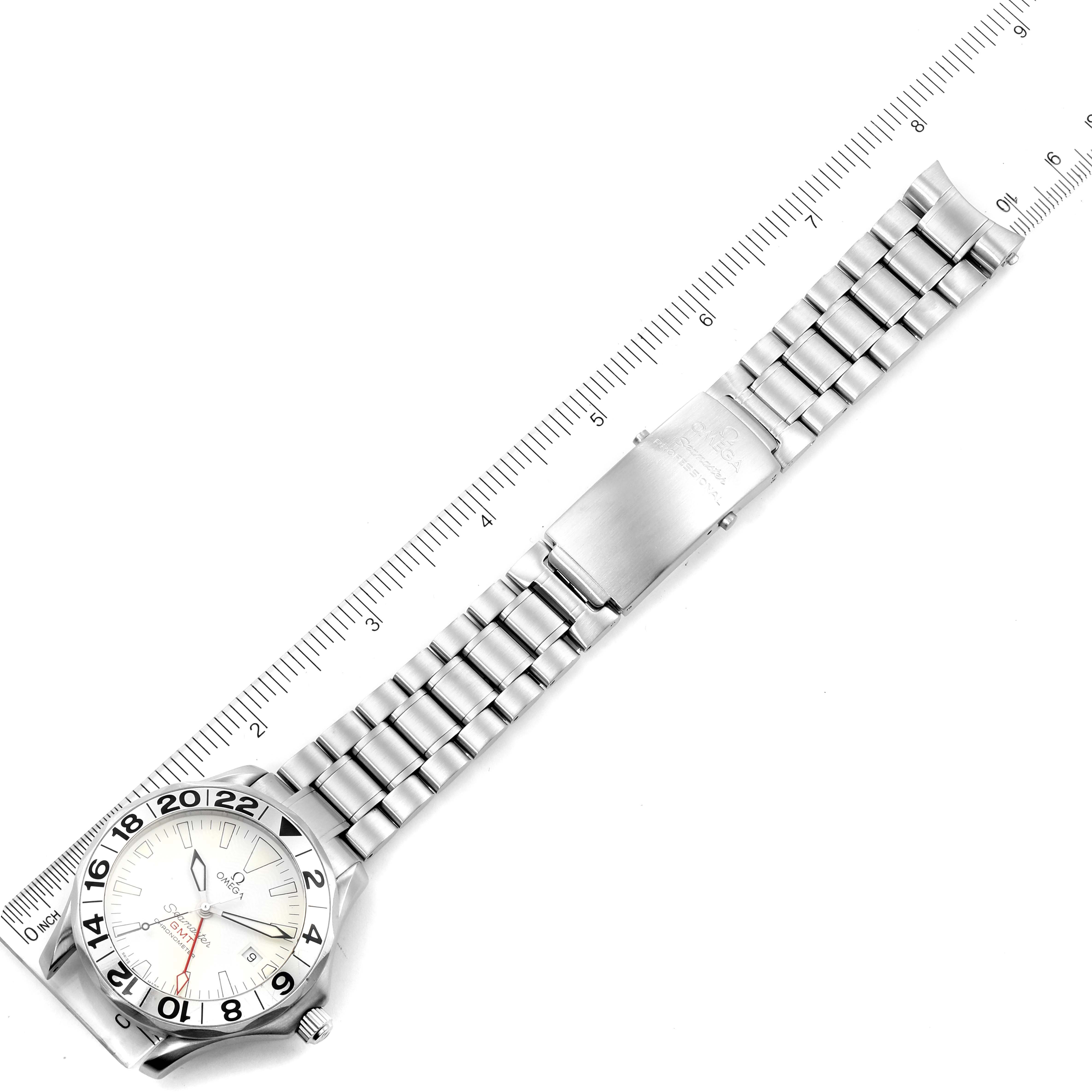 The image shows a top-down view of an Omega Seamaster 2538.20.00 Men's Stainless Steel White Dial 2538.20.00 Men's Stainless Steel White Dial watch with a stainless steel bracelet next to a ruler for scale.