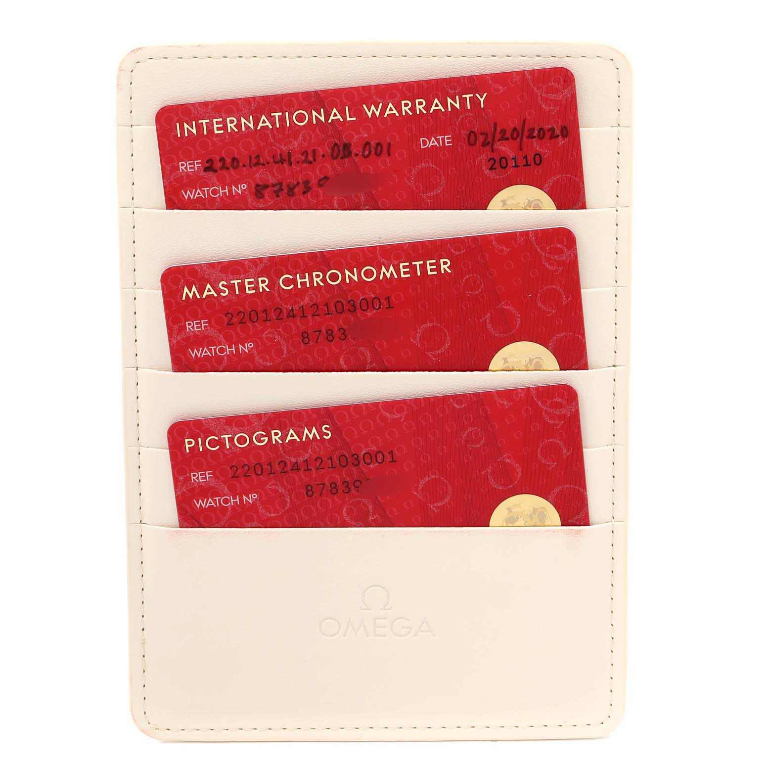 The image shows the warranty cards for an Omega Aqua Terra 220.12.41.21.03.001  Men
s Stainless Steel Blue Dial 220.12.41.21.03.001  Men
s Stainless Steel Blue Dial watch inside a cream-colored cardholder.