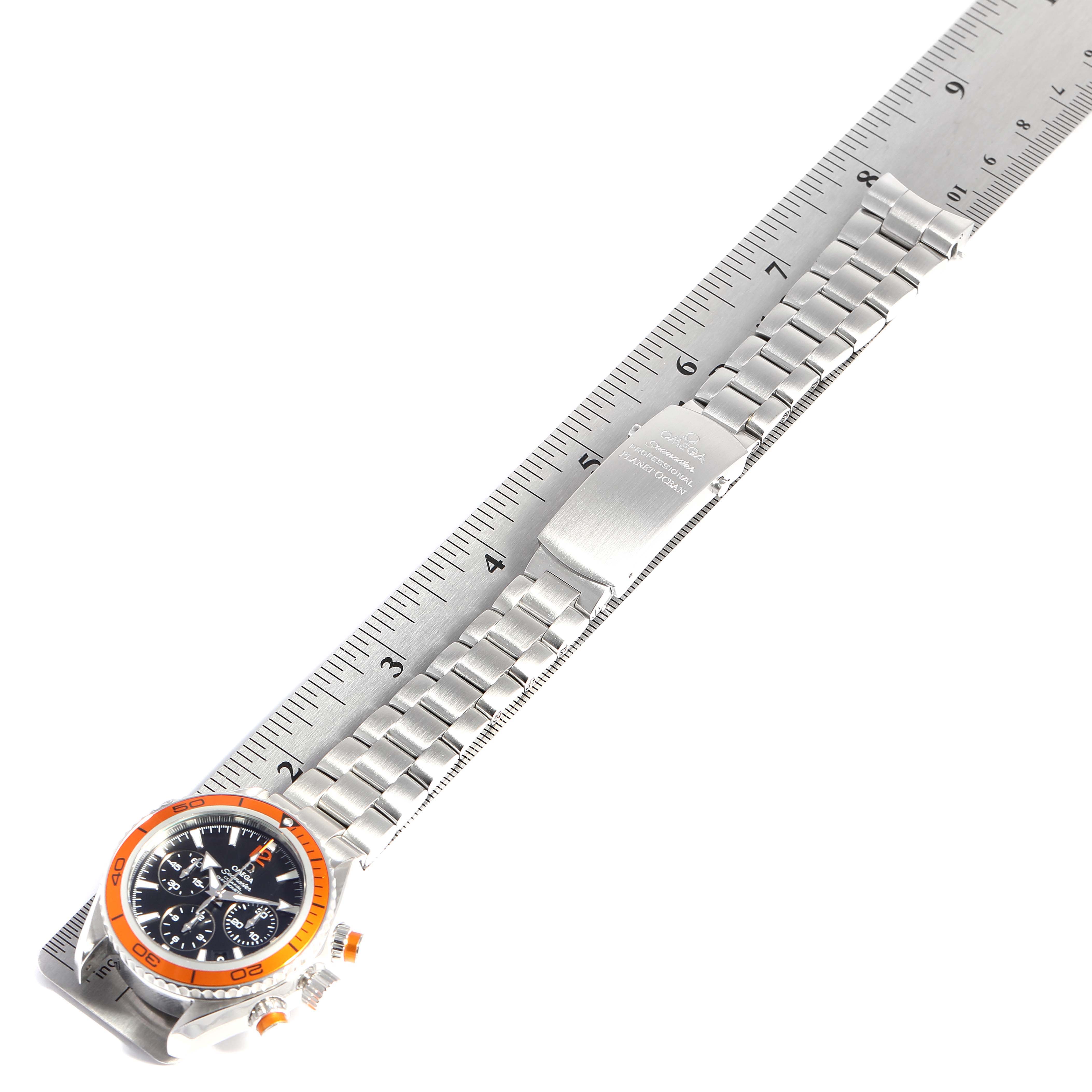 The Omega Seamaster 222.30.38.50.01.002 Men
s Stainless Steel Black Dial 222.30.38.50.01.002 Men
s Stainless Steel Black Dial watch is shown at an angle, displaying the face, bezel, and metal bracelet against a ruler background.