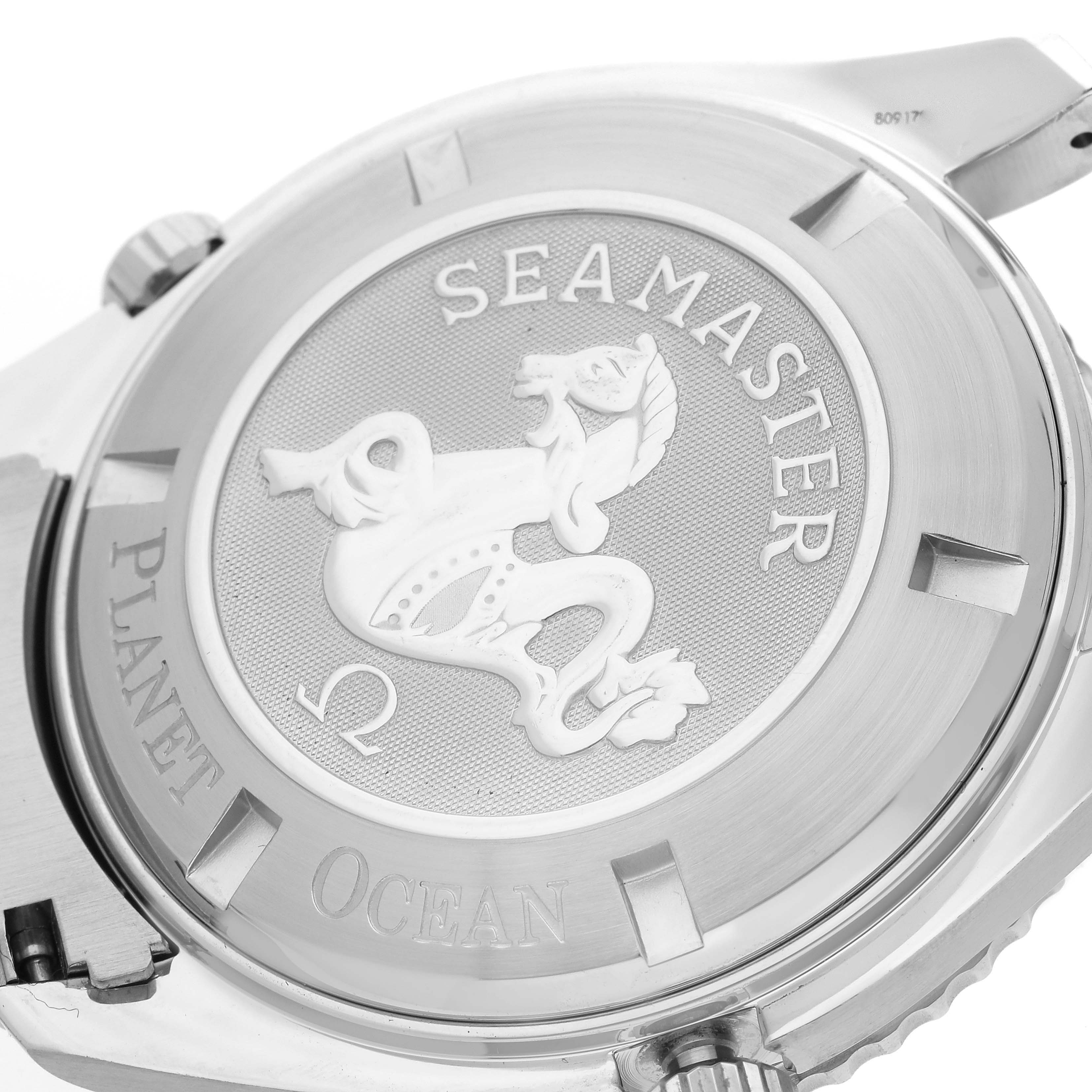 This image shows the back case of the Omega Planet Ocean 2208.50.00 Men
s Stainless Steel Black Dial 2208.50.00 Men
s Stainless Steel Black Dial Seamaster watch with engravings and a seahorse logo.