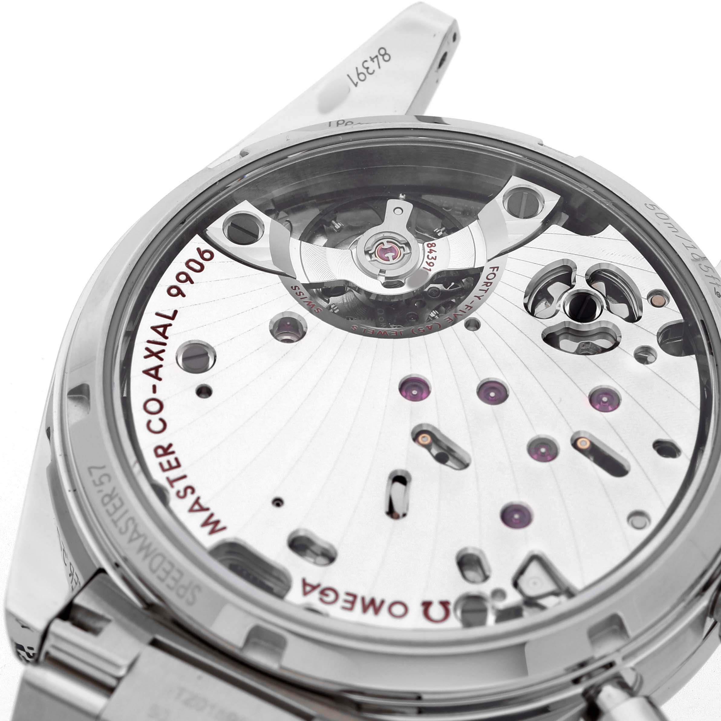 The image shows the back side of the Omega Speedmaster 332.10.41.51.11.001 Men's Stainless Steel Red Dial, highlighting the Master Co-Axial 9906 movement.