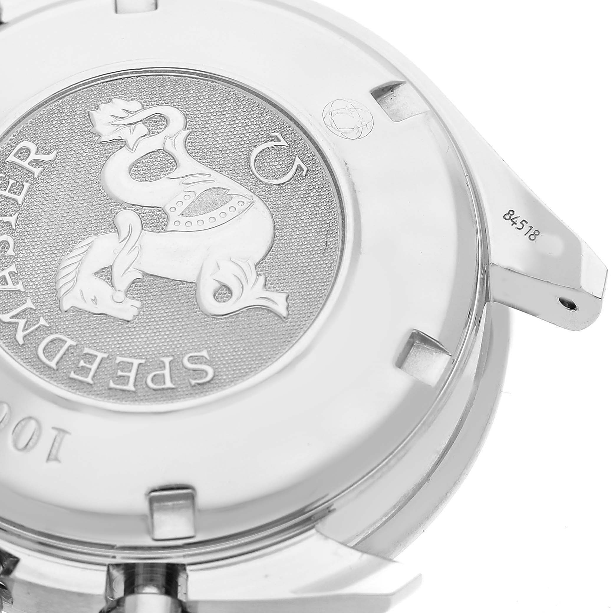 The image shows the case back of an Omega Speedmaster 3210.51.00 Men's Stainless Steel Black Dial, featuring the engraved emblem and model details.