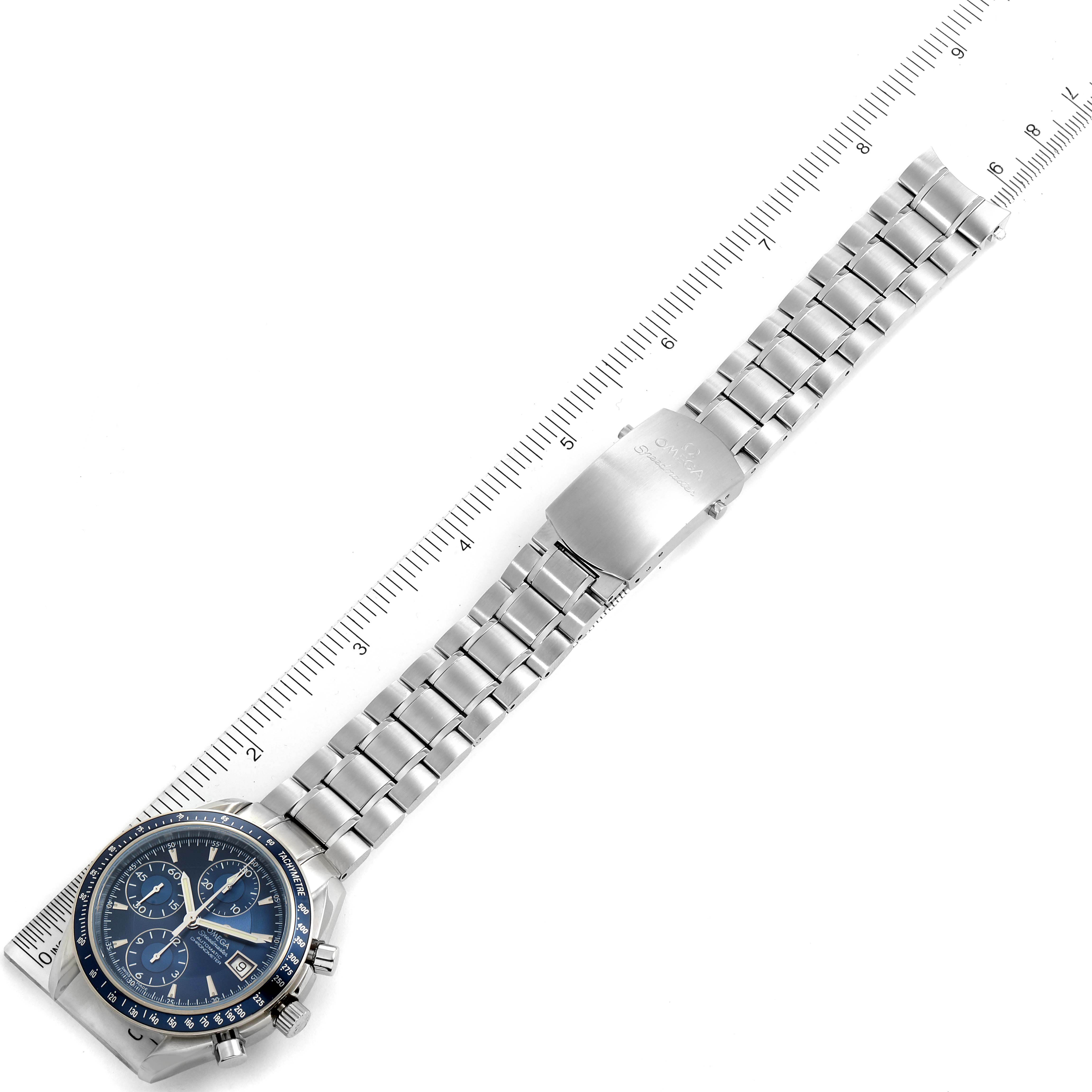 The image shows an Omega Speedmaster 3212.80.00 Men
s Stainless Steel Blue Dial 3212.80.00 Men
s Stainless Steel Blue Dial watch laid flat, capturing the full length of the band alongside a ruler for scale comparison.