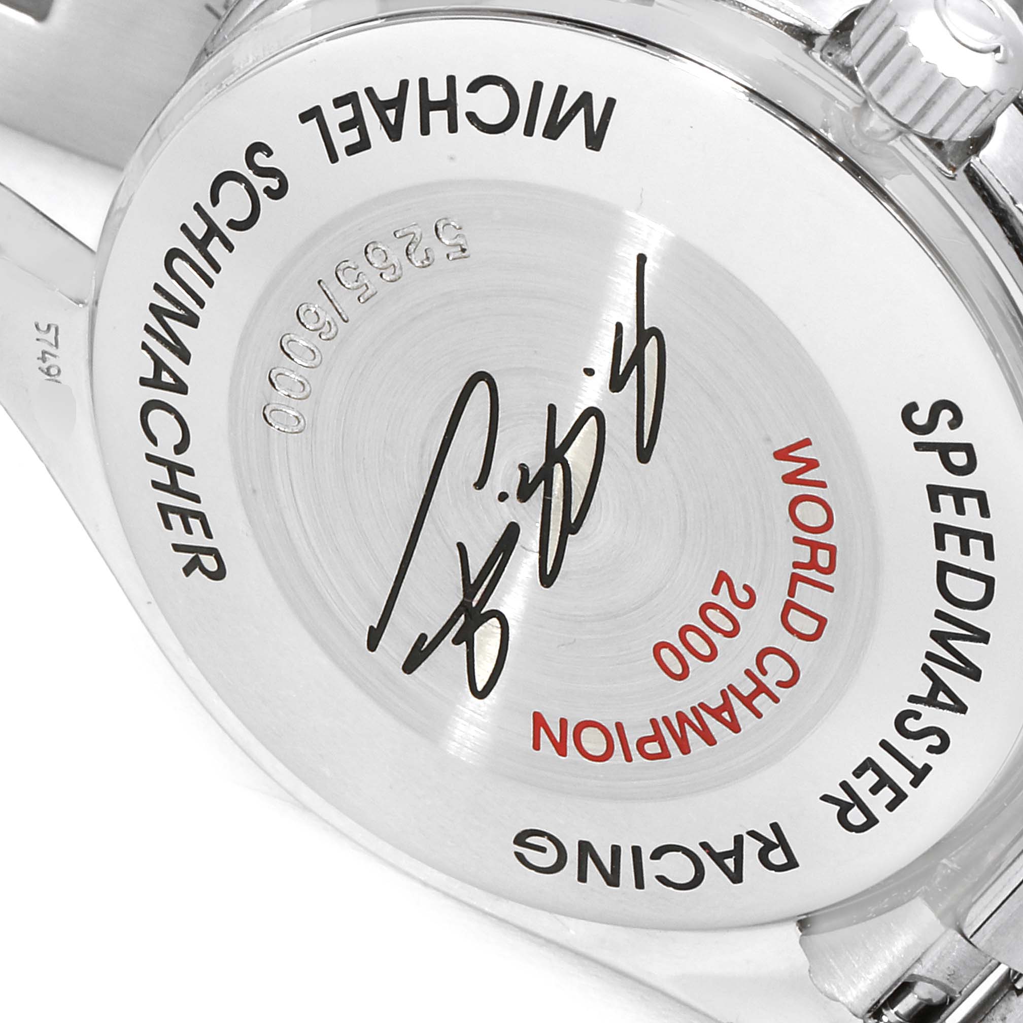 The image shows the back case of an Omega Speedmaster 3518.50.00 Men
s Stainless Steel Black Dial 3518.50.00 Men
s Stainless Steel Black Dial watch, featuring the words "MICHAEL SCHUMACHER" and "WORLD CHAMPION 2000."