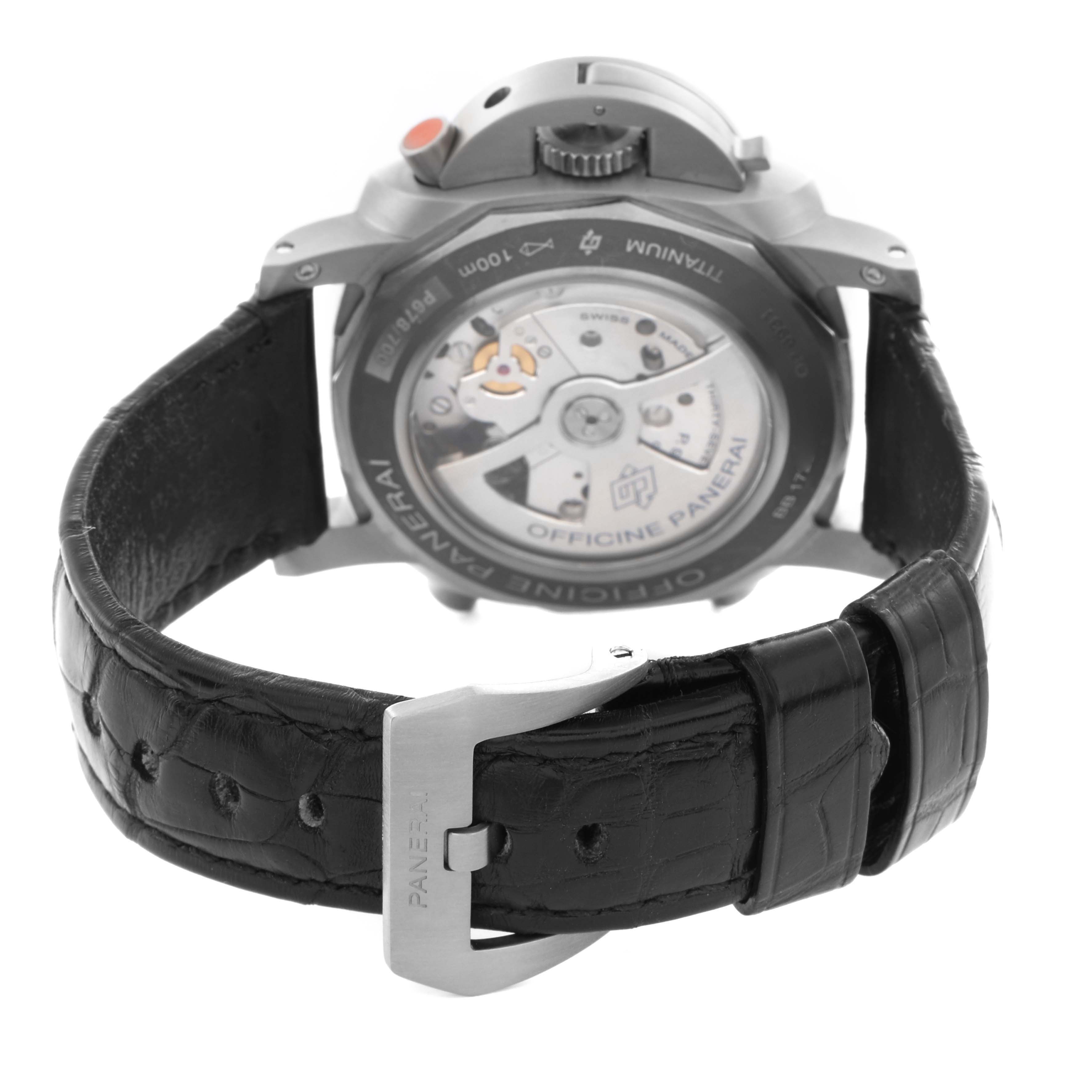 The image shows the back view of a Panerai Luminor PAM00526 Men's Titanium Black Dial PAM00526 Men's Titanium Black Dial watch, displaying its movement and black leather strap with a buckle.