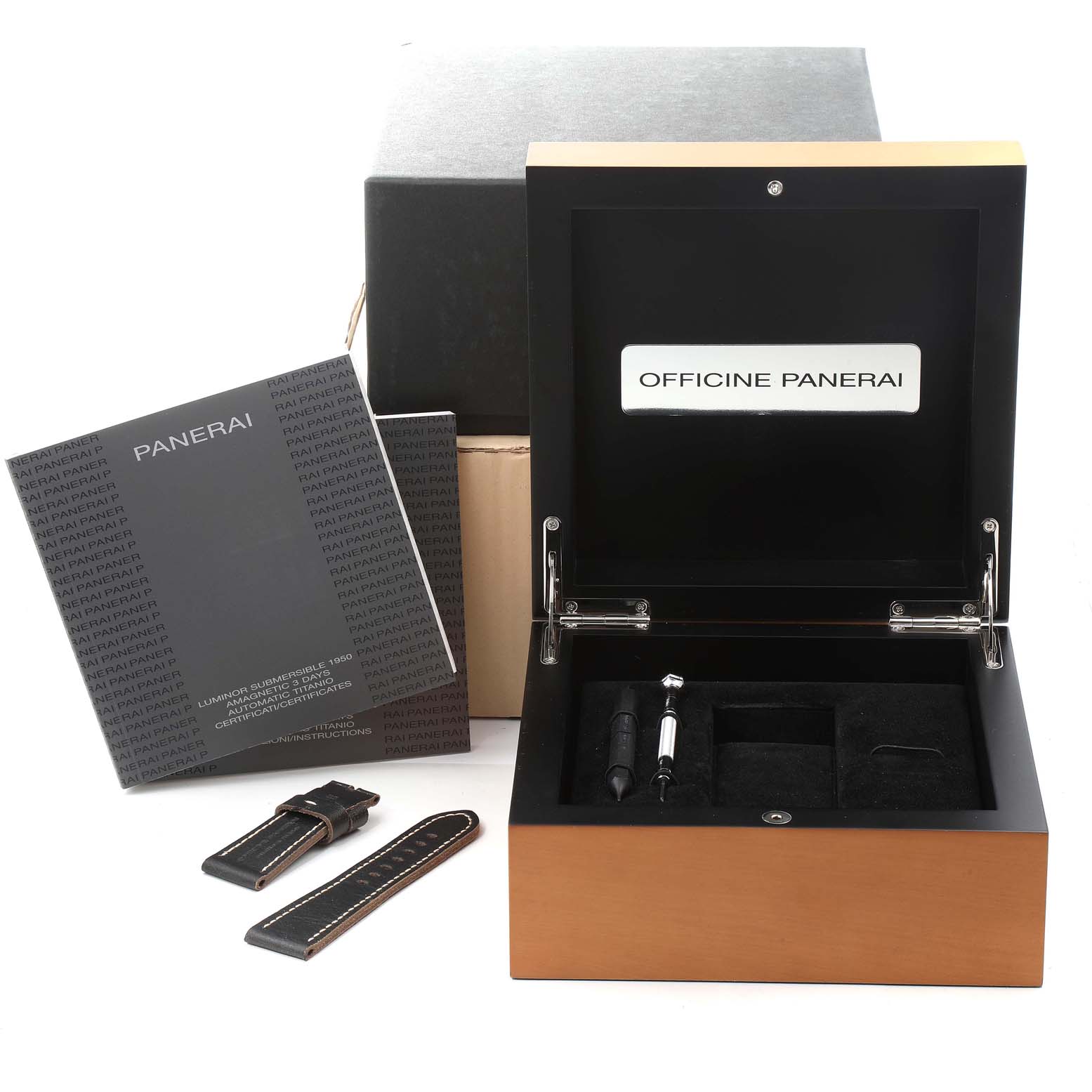This image shows the Panerai Submersible PAM00389 Men's Titanium Black Dial PAM00389 Men's Titanium Black Dial watch box, manual, additional straps, and tool from a frontal angle.