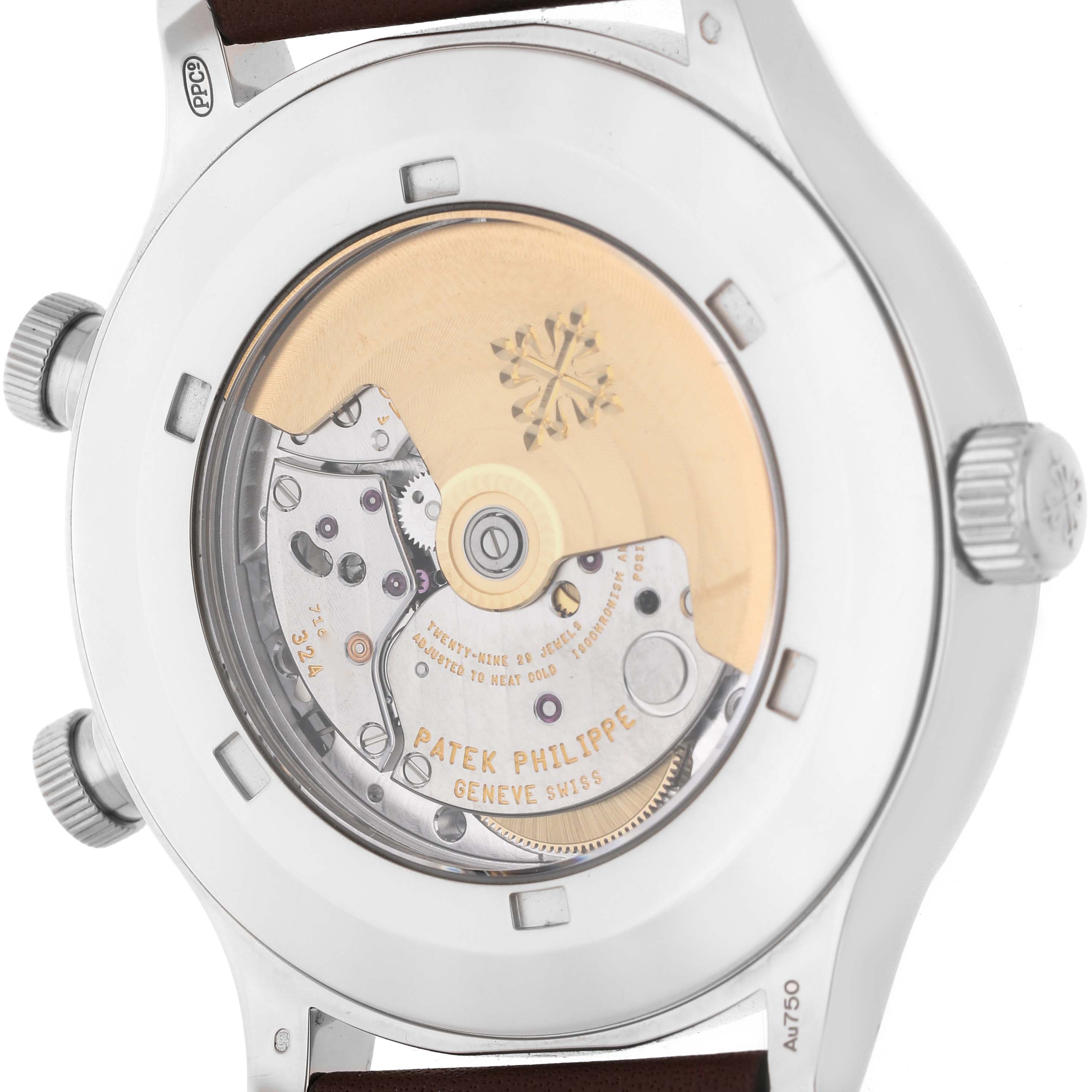 The image shows the back of a Patek Philippe Calatrava 5524G-001 Men's White Gold Black Dial watch, highlighting the movement and transparent case back.