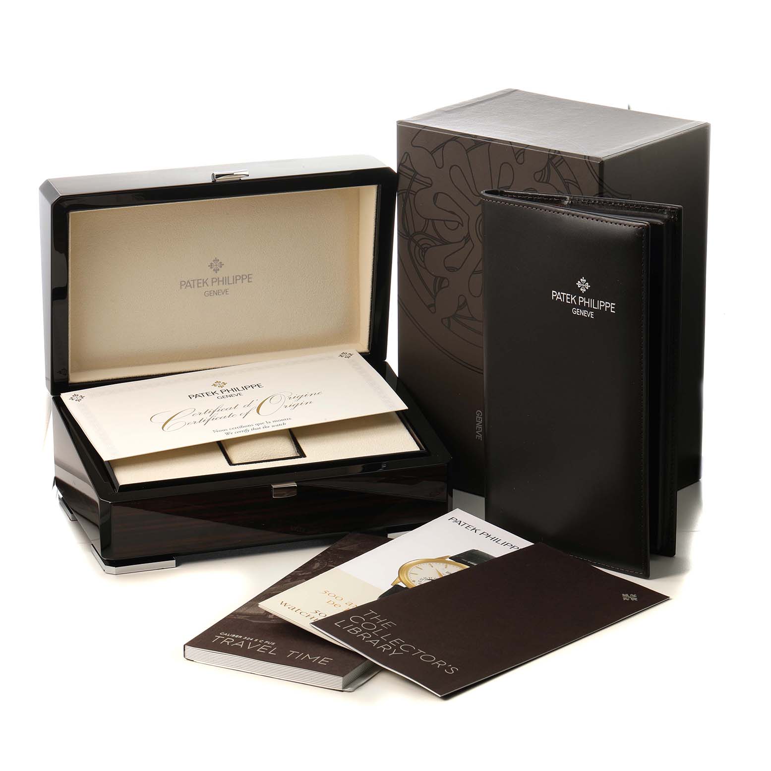 The image shows the Patek Philippe Calatrava 5524G-001 Men's White Gold Black Dial watch box, certificate, and booklets from an angled side view.