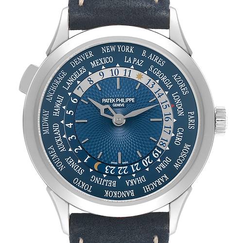 The image shows a Patek Philippe Complications 5230P-001 Men's Platinum Blue Dial watch face from a top angle, highlighting its intricate dial and city names.