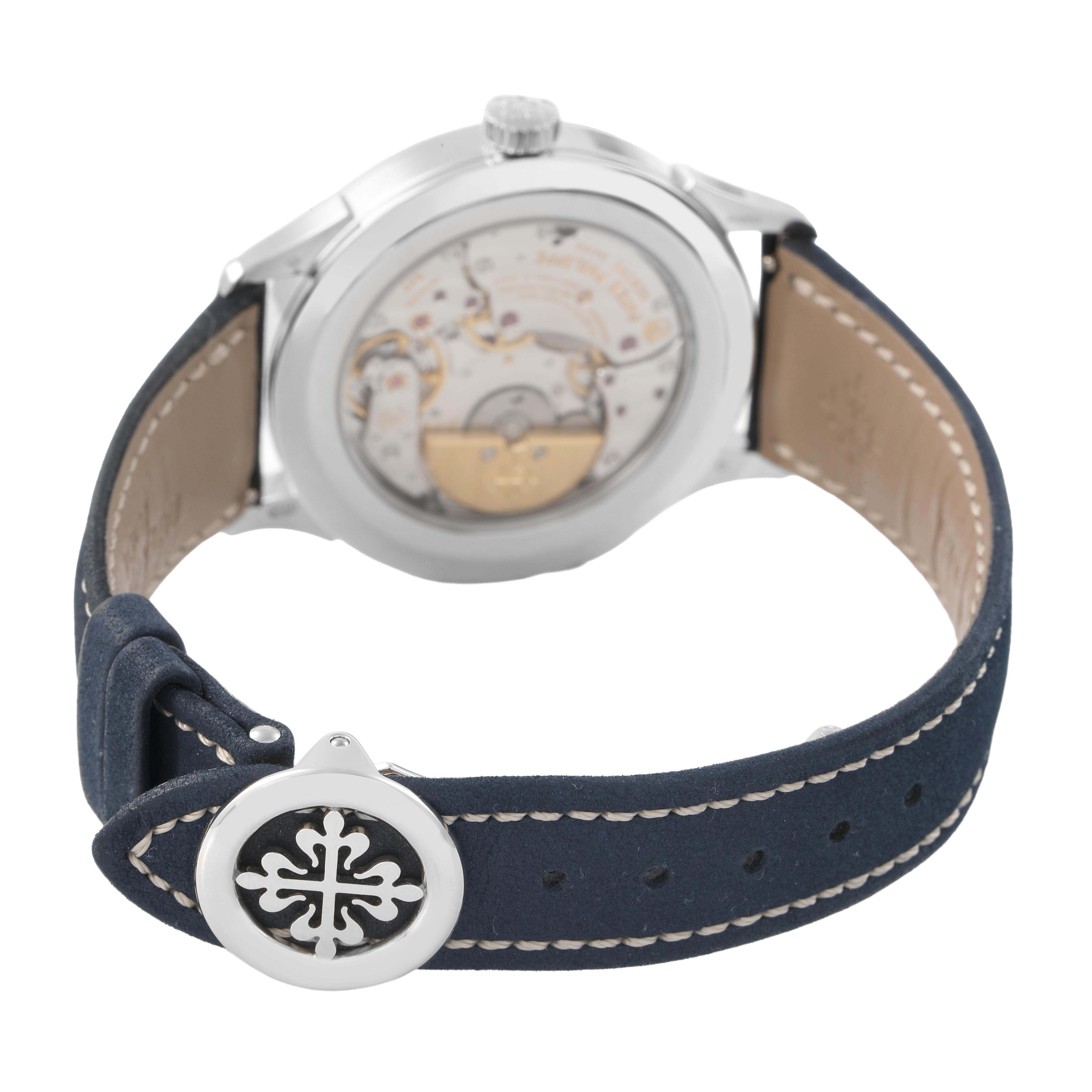 The Patek Philippe Complications 5230P-001 Men's Platinum Blue Dial watch is shown from a rear angle, highlighting the exhibition case back and part of the strap.