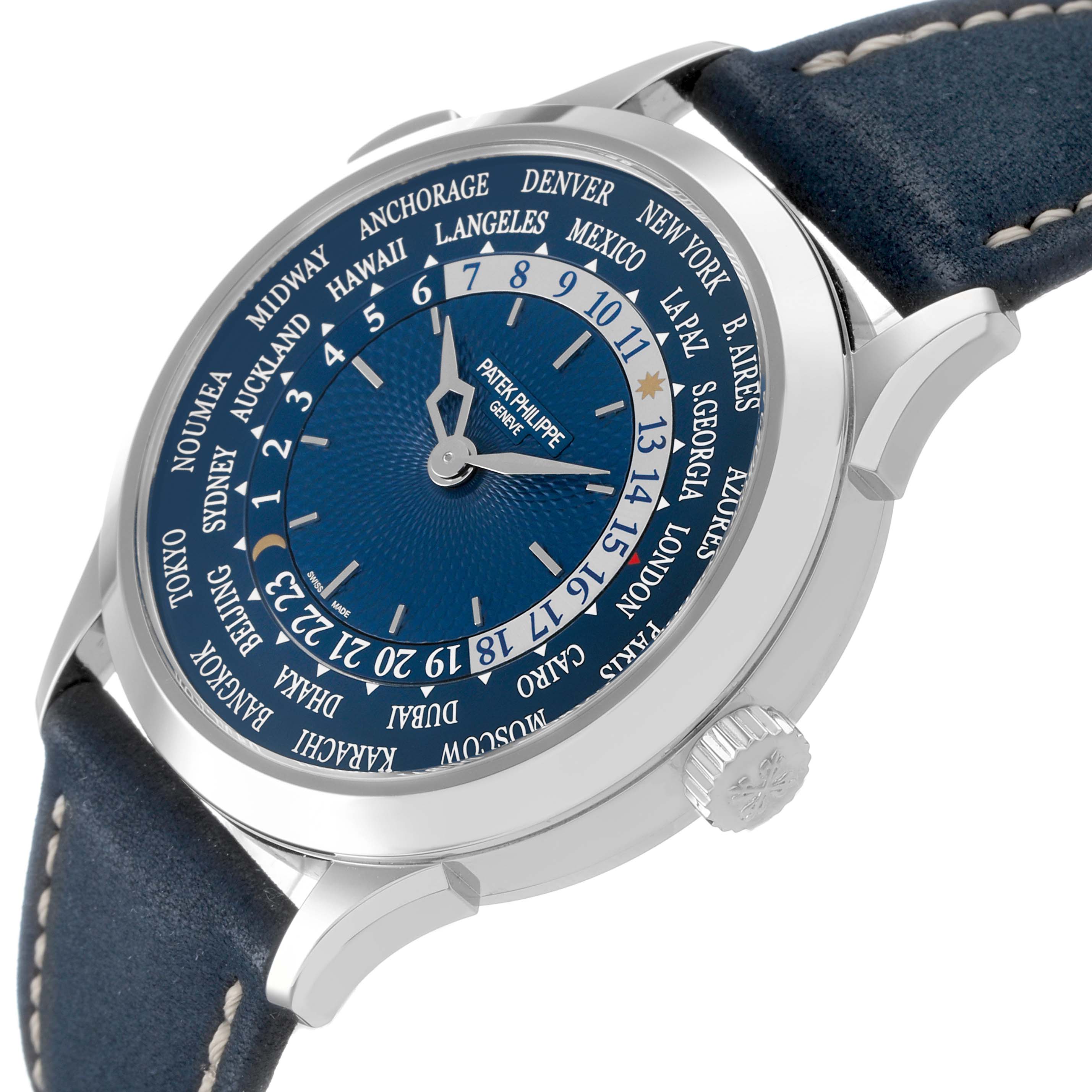 The Patek Philippe Complications 5230P-001 Men's Platinum Blue Dial model is shown at an oblique angle, displaying the dial, crown, and part of the leather strap.