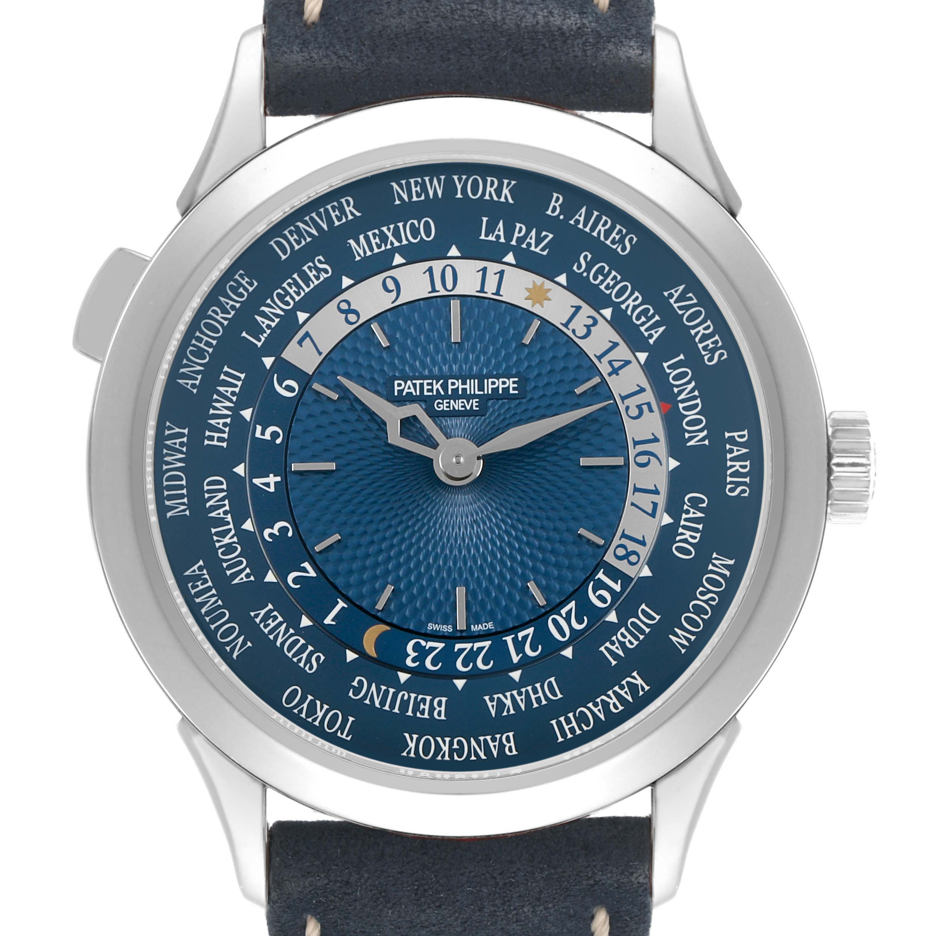 The Patek Philippe Complications 5230P-001 Men's Platinum Blue Dial model is shown from the front, highlighting its blue world-time dial and silver case.