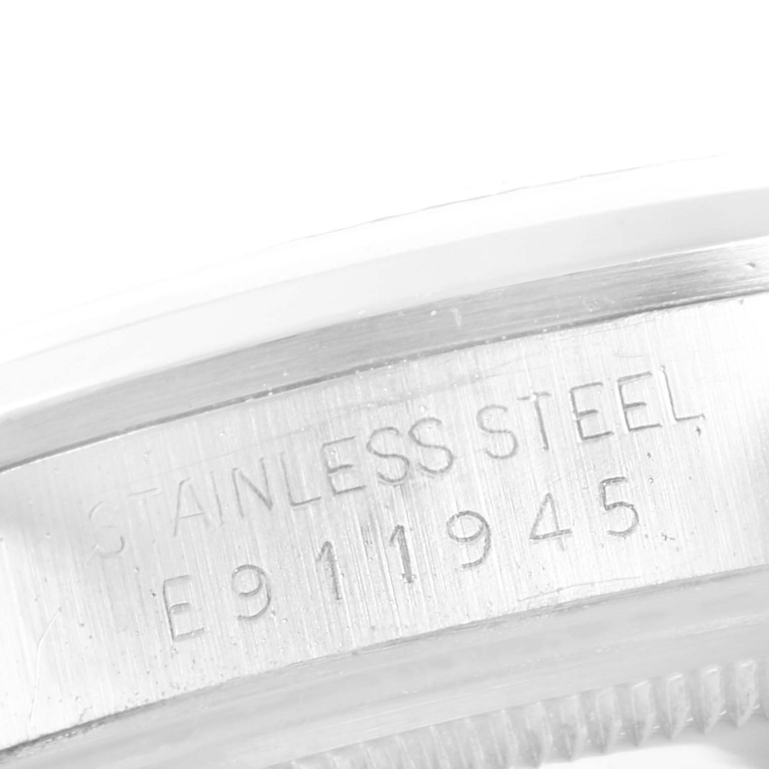 The image shows a close-up angle of the bezel and serial number engraving on a Rolex Air-King 14000 Men's Stainless Steel Grey Dial 14000 Men's Stainless Steel Grey Dial watch.