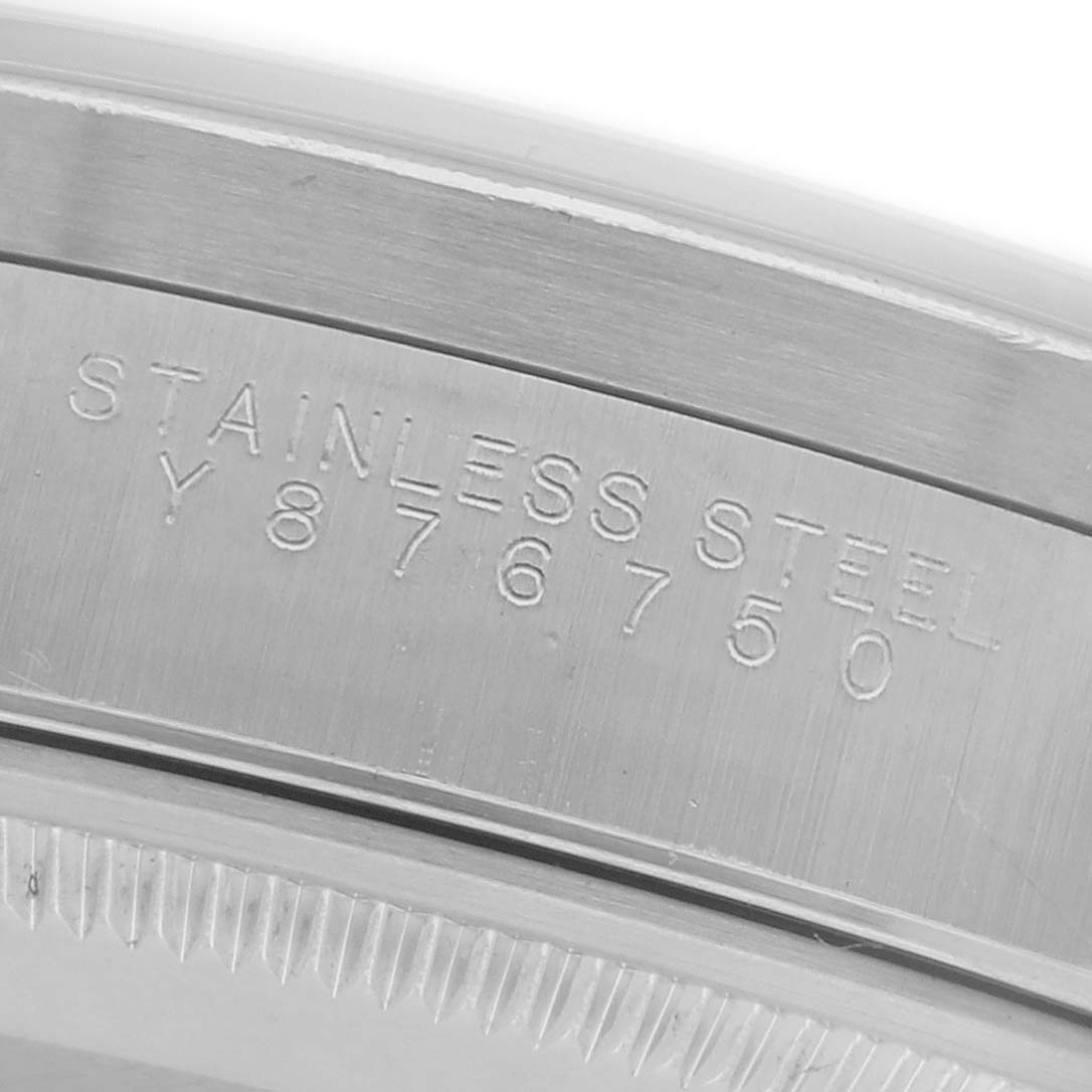 The image shows a close-up of the Rolex Air-King 14010 Men's Stainless Steel Pink Dial 14010 Men's Stainless Steel Pink Dial's case edge, highlighting the engraved serial number.