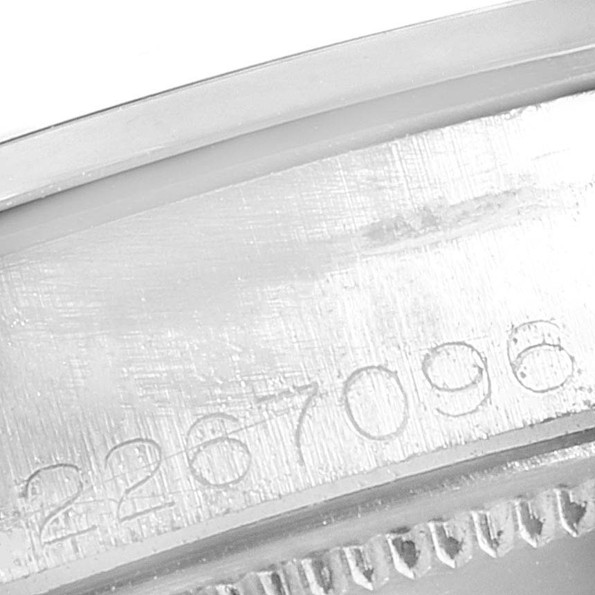 This is a close-up of the serial number engraving on the case of a Rolex Air-King 5500 Men's Stainless Steel Silver Dial 5500 Men's Stainless Steel Silver Dial watch.