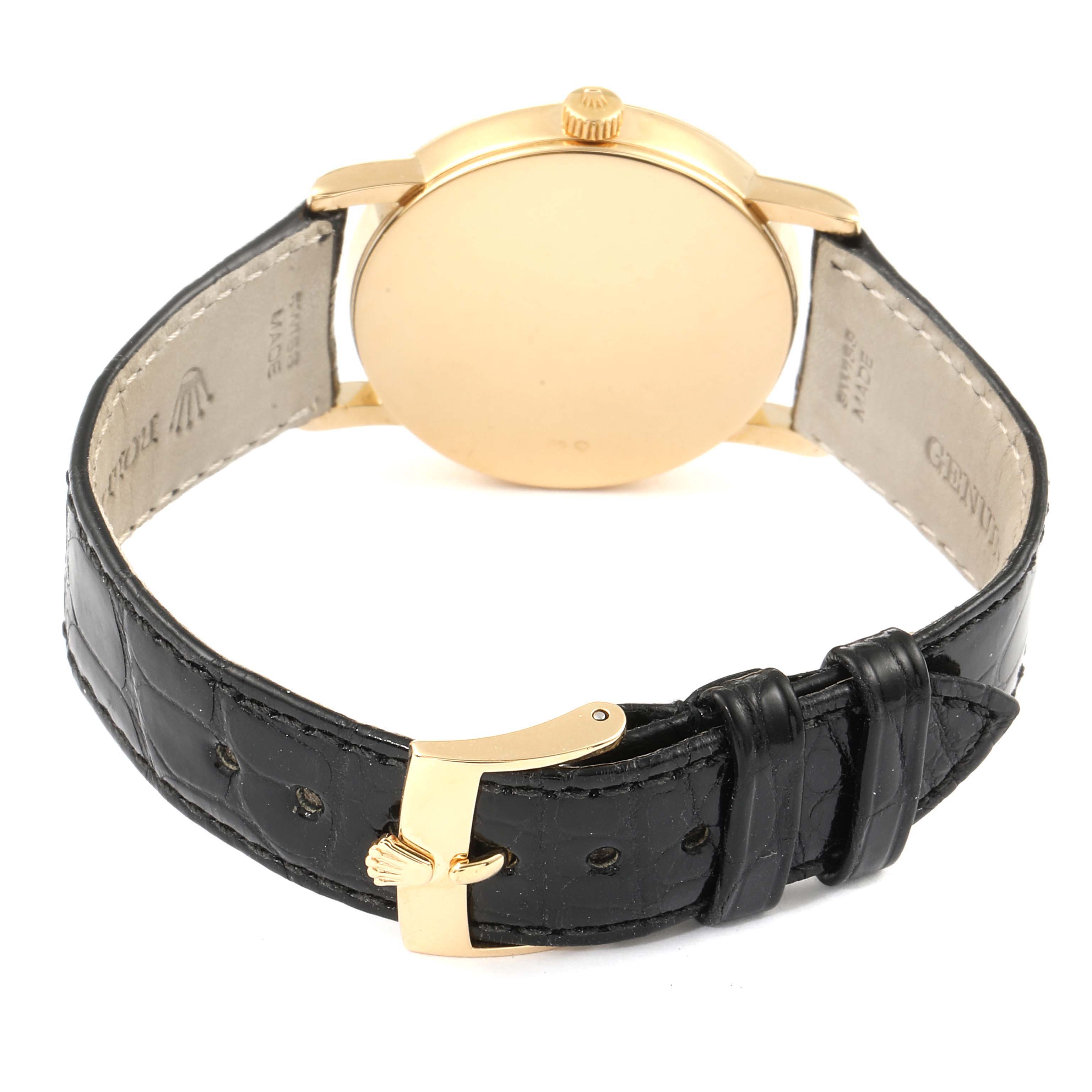 The image shows the rear view of a Rolex Cellini 5115 Men's Yellow Gold Silver Dial 5115 Men's Yellow Gold Silver Dial watch, highlighting its leather strap and gold buckle.