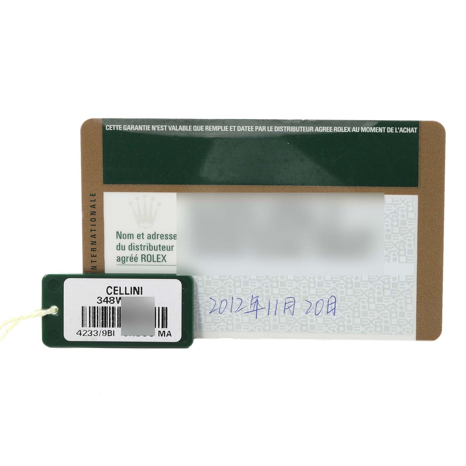 The image shows a Rolex Cellini 4233/9BIC Men's Steel and Gold (two tone) White Dial 4233/9BIC Men's Steel and Gold (two tone) White Dial model tag and a warranty card placed at an angle, displaying the tag's barcode and handwritten details on the card.