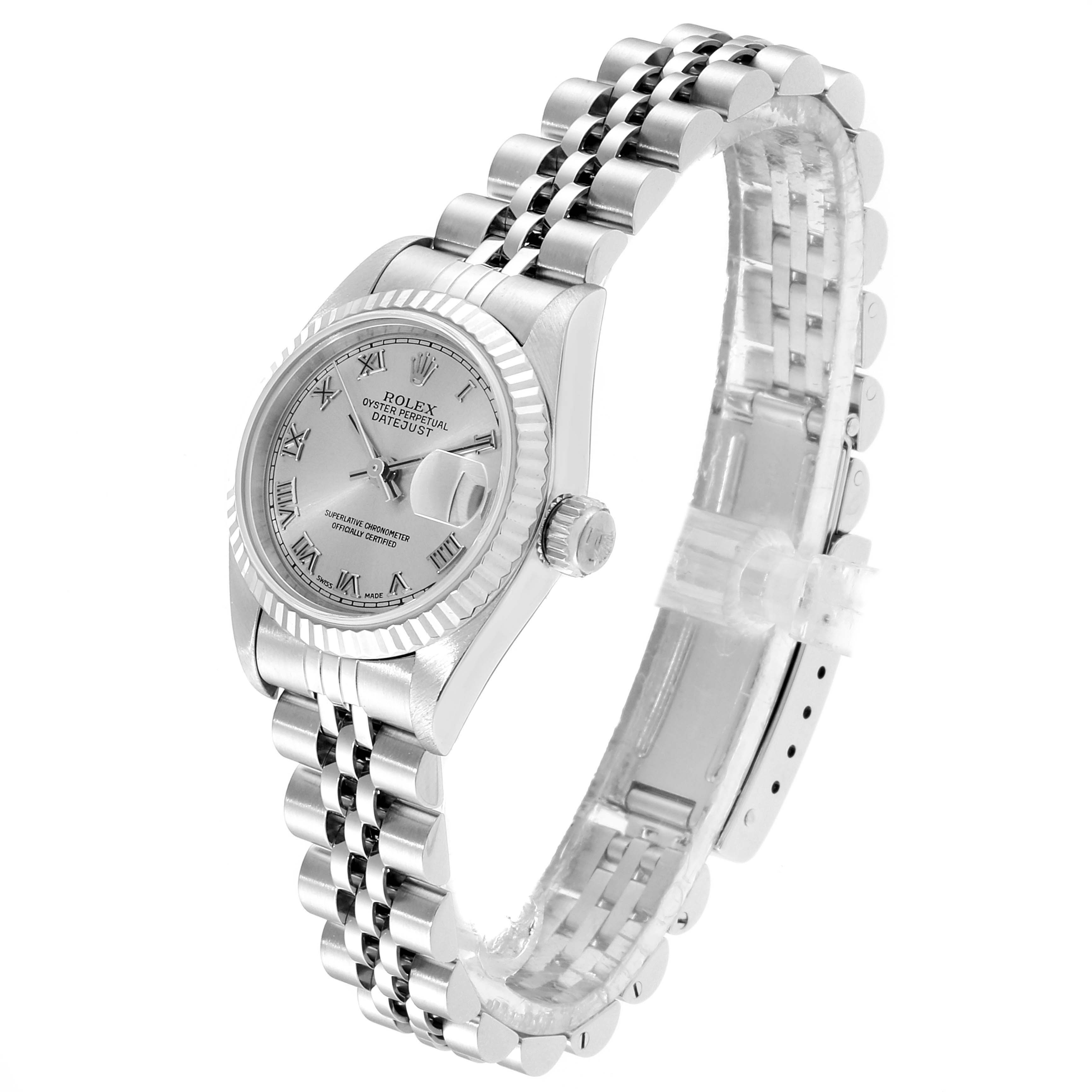 The image shows a Rolex Datejust 79174 Women
s Stainless Steel Silver Dial 79174 Women
s Stainless Steel Silver Dial watch from a 3/4 angle, highlighting its face, bezel, and bracelet.
