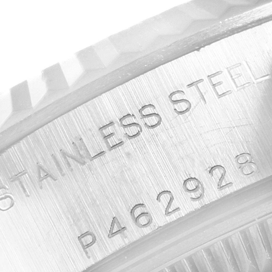 The image shows a close-up of the serial number and material inscription on the side of the Rolex Datejust 79174 Women
s Stainless Steel Silver Dial 79174 Women
s Stainless Steel Silver Dial watch case.