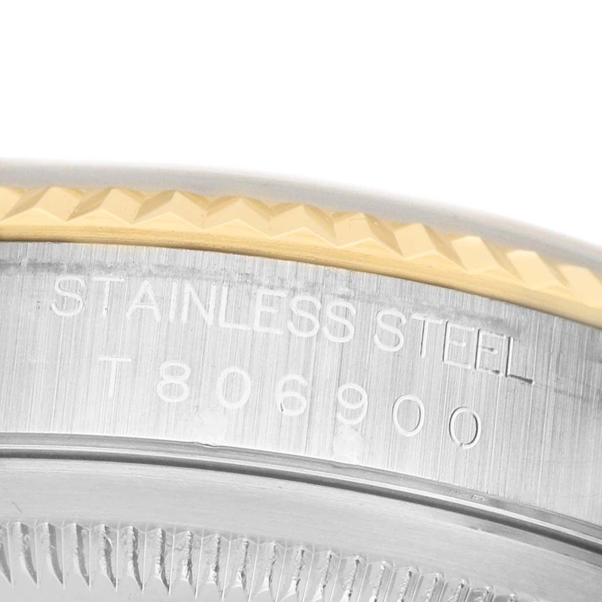 The image shows a close-up angle of the side of a Rolex Datejust 16233 Men's Stainless Steel Champagne Dial, highlighting the stainless steel engraving and fluted bezel.