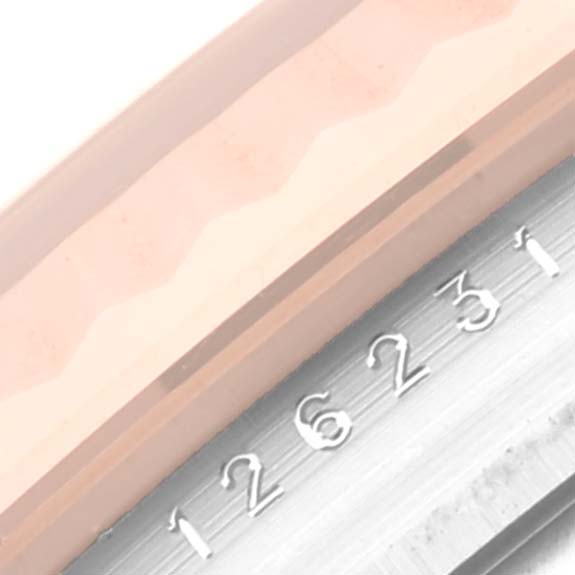 The image shows a close-up of the Datejust model by Rolex, focusing on the bezel and part of the dial with numbers.
