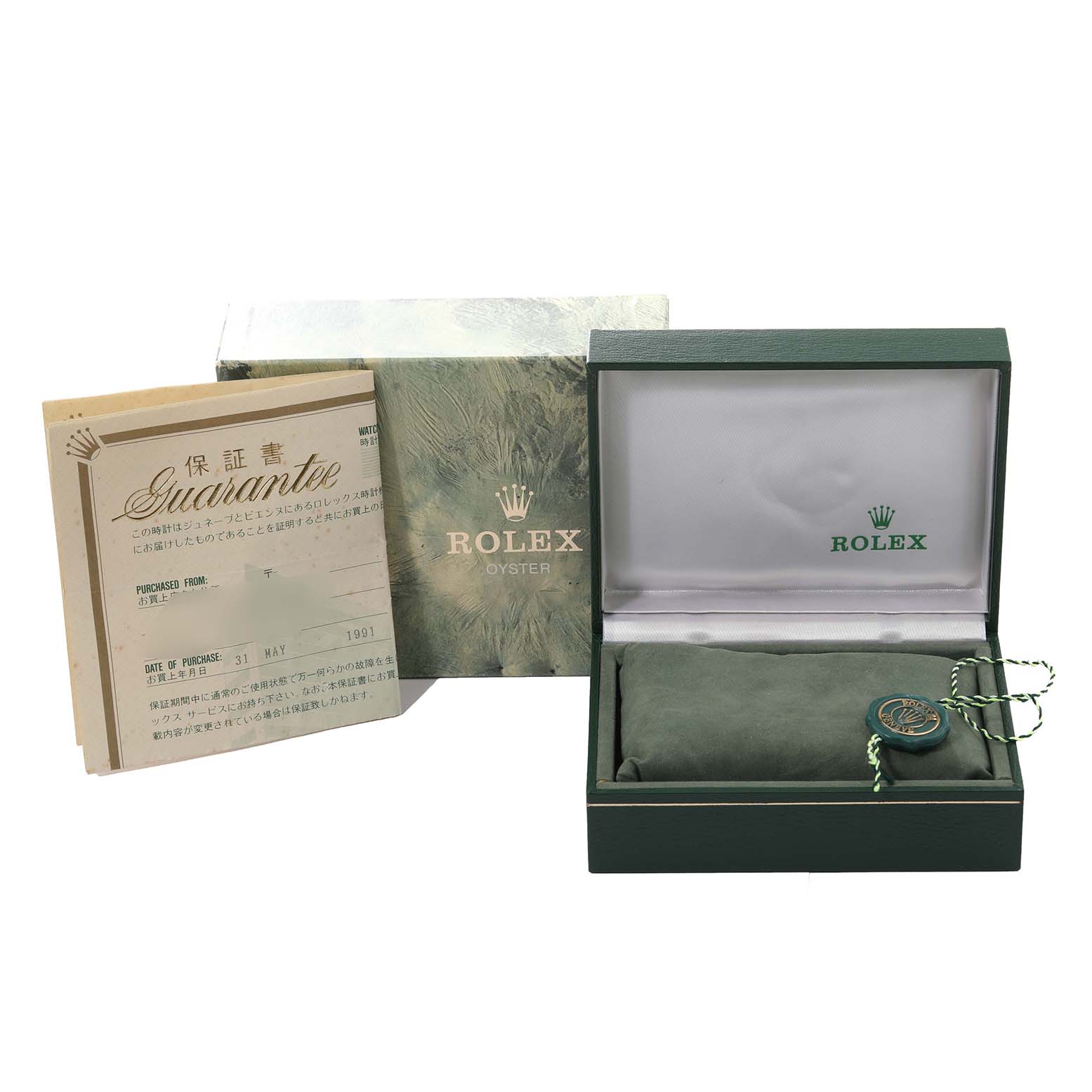 The image shows a Rolex Datejust 16233 Men's Steel and Gold (two tone) Blue Dial 16233 Men's Steel and Gold (two tone) Blue Dial watch box, a green pillow, an authenticity tag, a guarantee card, and an outer box.