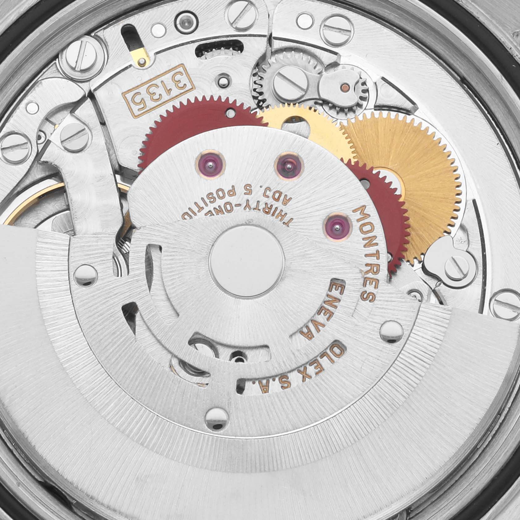 The image shows a close-up of the movement mechanism of a Rolex Datejust 16233 Men's Steel and Gold (two tone) Blue Dial 16233 Men's Steel and Gold (two tone) Blue Dial watch, highlighting the gears and engravings.