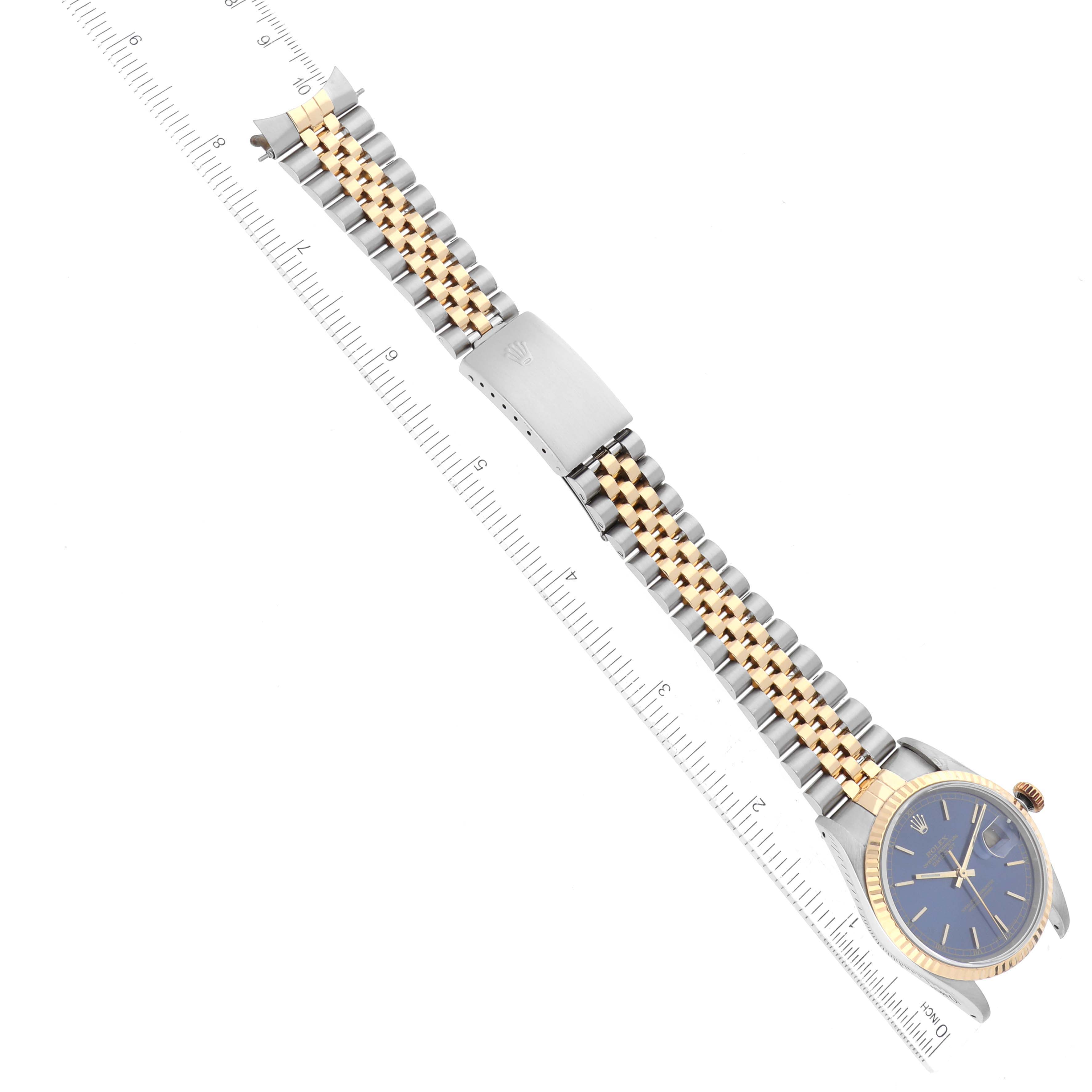 The image shows a Rolex Datejust 16233 Men's Steel and Gold (two tone) Blue Dial 16233 Men's Steel and Gold (two tone) Blue Dial watch from a top-down angle, including its entire dial, bezel, and two-tone bracelet.