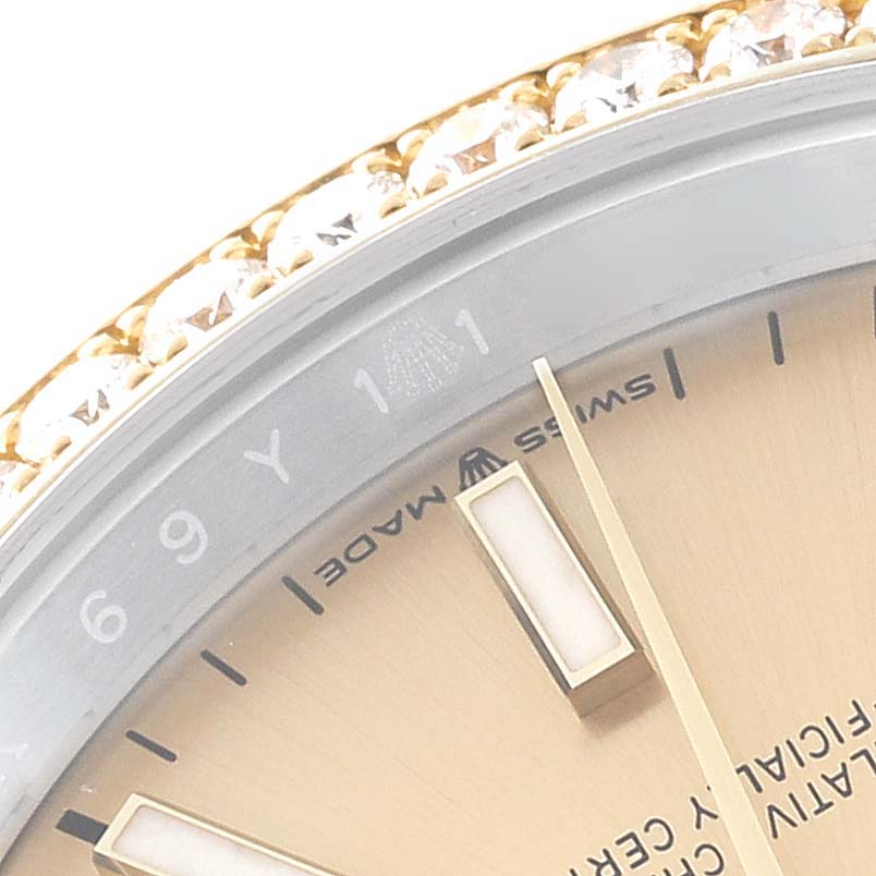 This close-up angle of the Rolex Datejust 126283 Men's Steel and Gold (two tone) Champagne Dial 126283 Men's Steel and Gold (two tone) Champagne Dial shows part of the dial and bezel, highlighting the "Swiss Made" text.