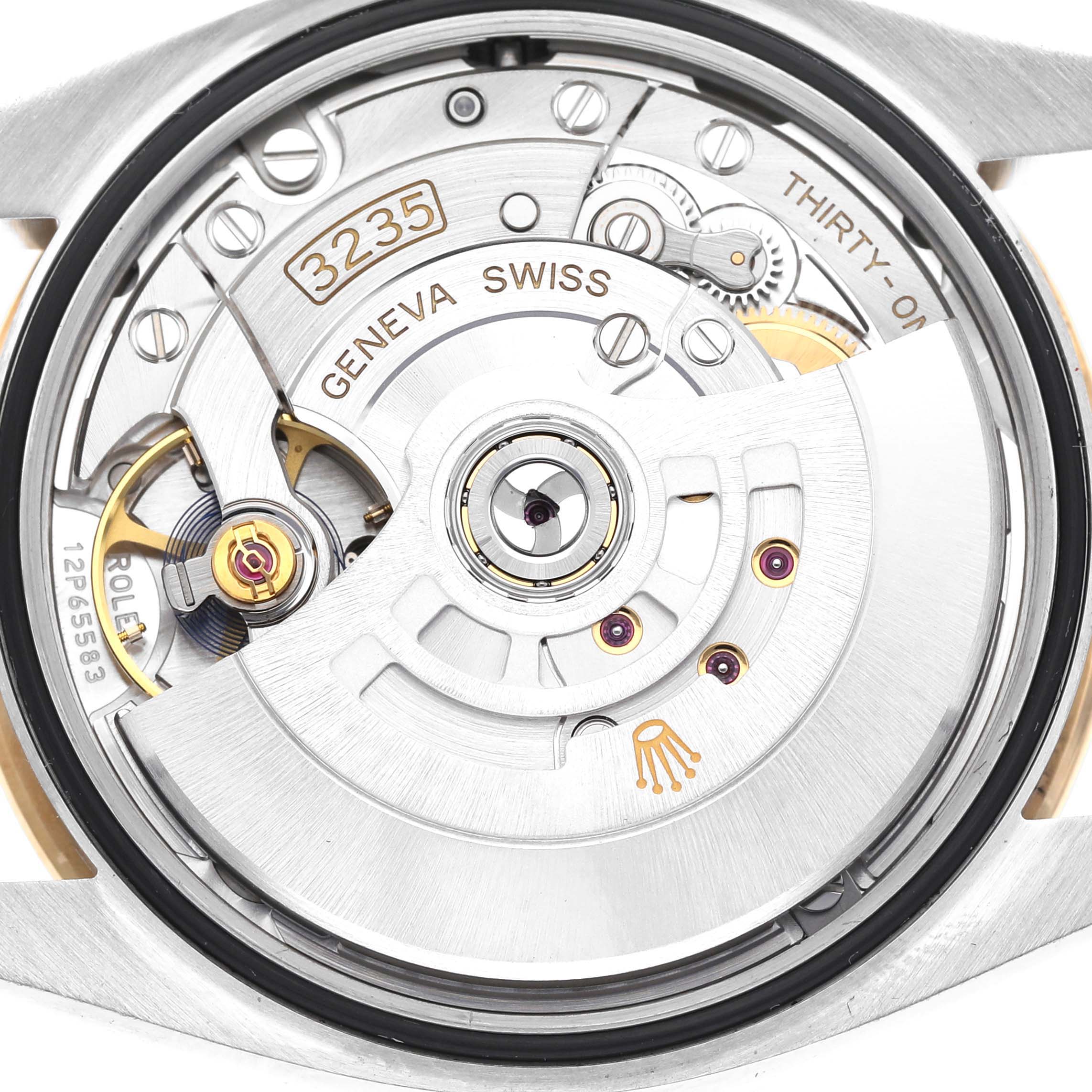 The image shows the Rolex Datejust 126283 Men's Steel and Gold (two tone) Champagne Dial 126283 Men's Steel and Gold (two tone) Champagne Dial watch's movement from a rear angle, revealing its intricate gears and rotor with the "3235" mark.