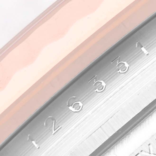 This close-up image shows the date wheel and part of the bezel of a Rolex Datejust 41 126331 Men
s Steel and Gold (two tone) Brown Dial 126331 Men
s Steel and Gold (two tone) Brown Dial watch.