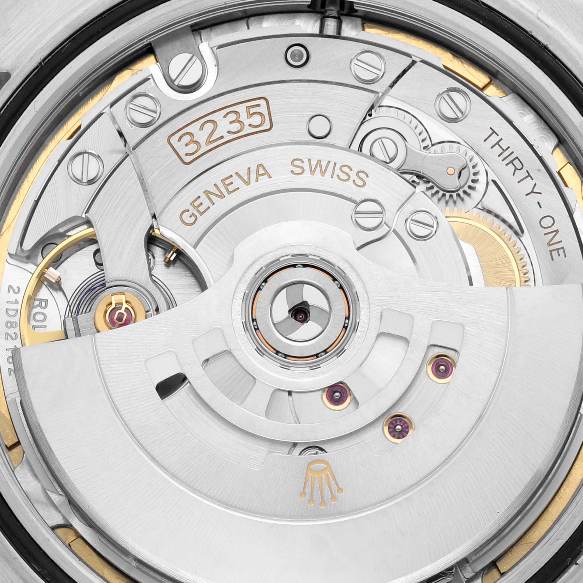 This image shows a close-up of the movement mechanism of the Rolex Datejust 41 126331 Men
s Steel and Gold (two tone) Brown Dial 126331 Men
s Steel and Gold (two tone) Brown Dial model, highlighting the "3235" caliber and intricate gear components.