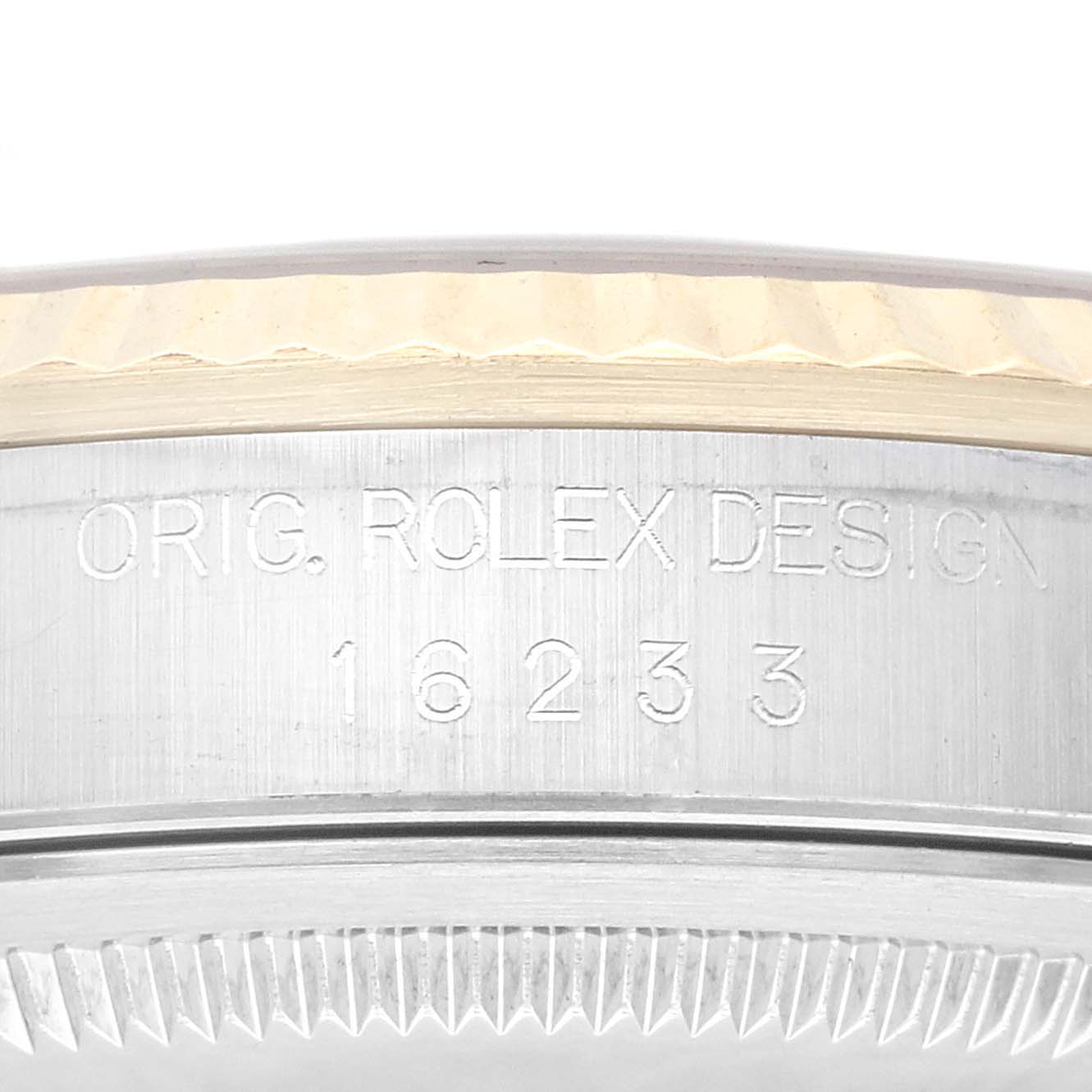This image shows the side engraving with the model number and bezel of a Rolex Datejust 16233 Men's Steel and Gold (two tone) Champagne Dial 16233 Men's Steel and Gold (two tone) Champagne Dial watch.
