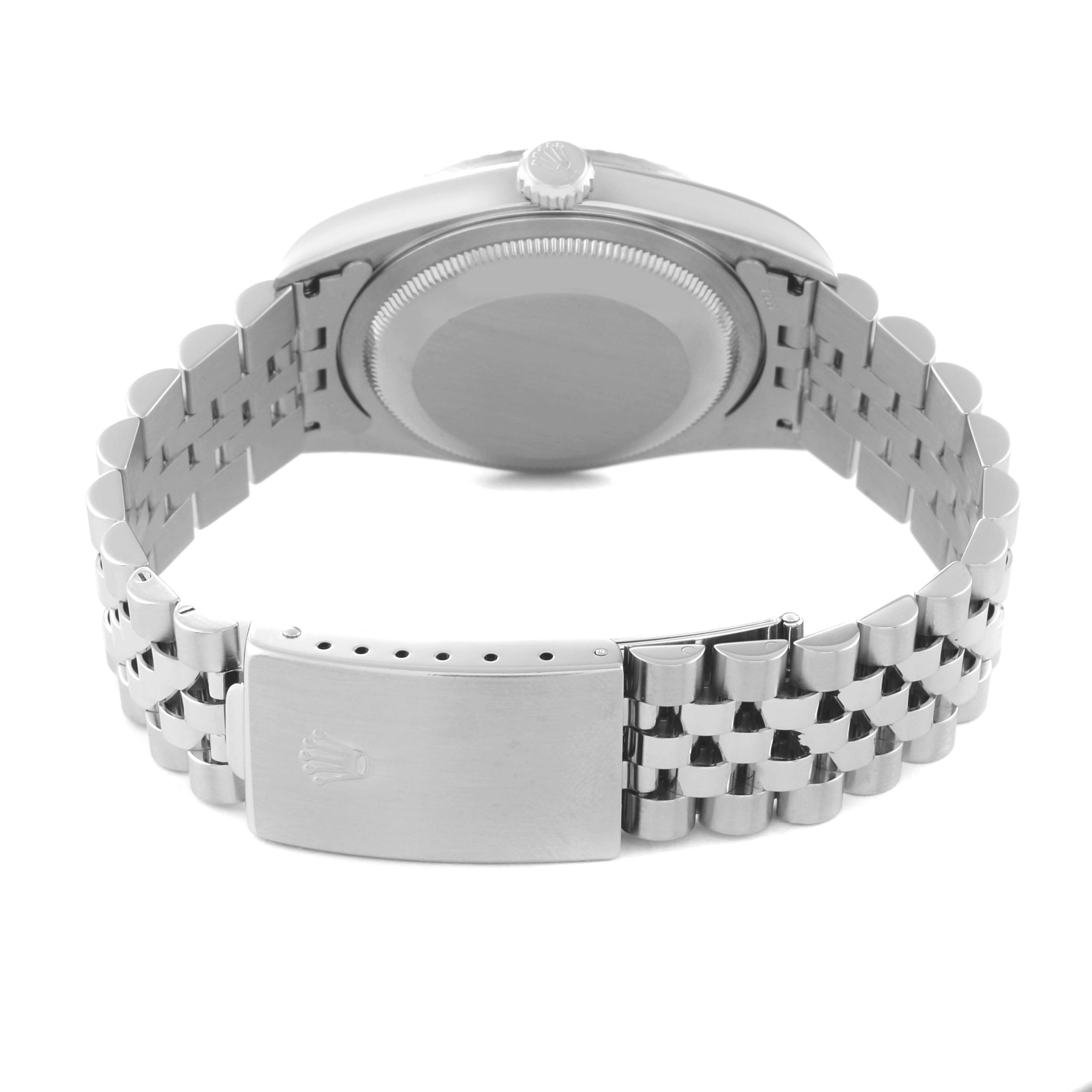 The image shows the back view of a Rolex Datejust 16220 Men's Stainless Steel Black Dial 16220 Men's Stainless Steel Black Dial watch, focusing on its clasp, bracelet, and case back.