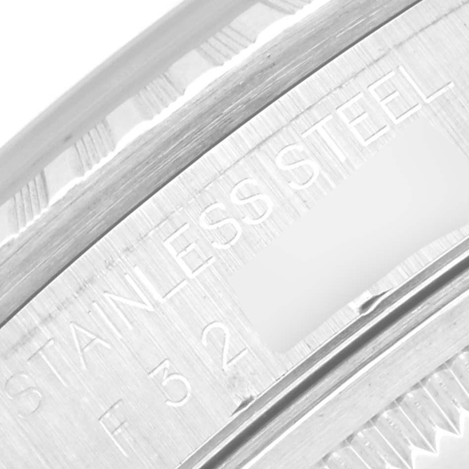 This image shows a close-up of the stainless steel part of a Rolex Datejust 16220 Men's Stainless Steel Black Dial 16220 Men's Stainless Steel Black Dial watch case, highlighting the engraved text.