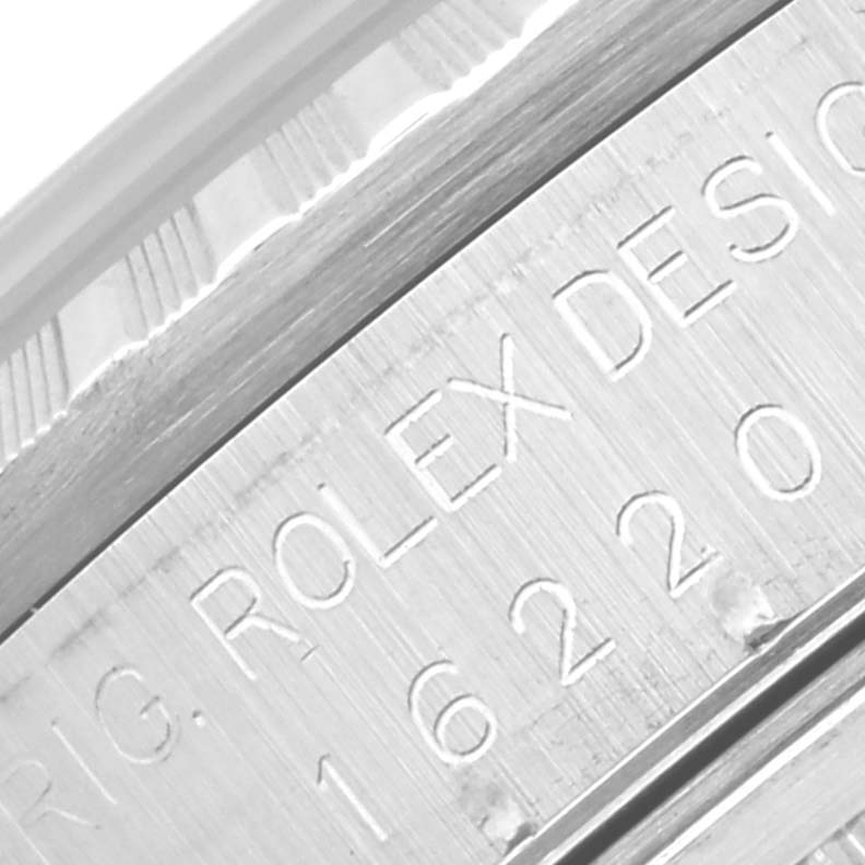 The image is a close-up of the side of the case of a Rolex Datejust 16220 Men's Stainless Steel Black Dial 16220 Men's Stainless Steel Black Dial, showing the model number and "Rolex Design" engraving.