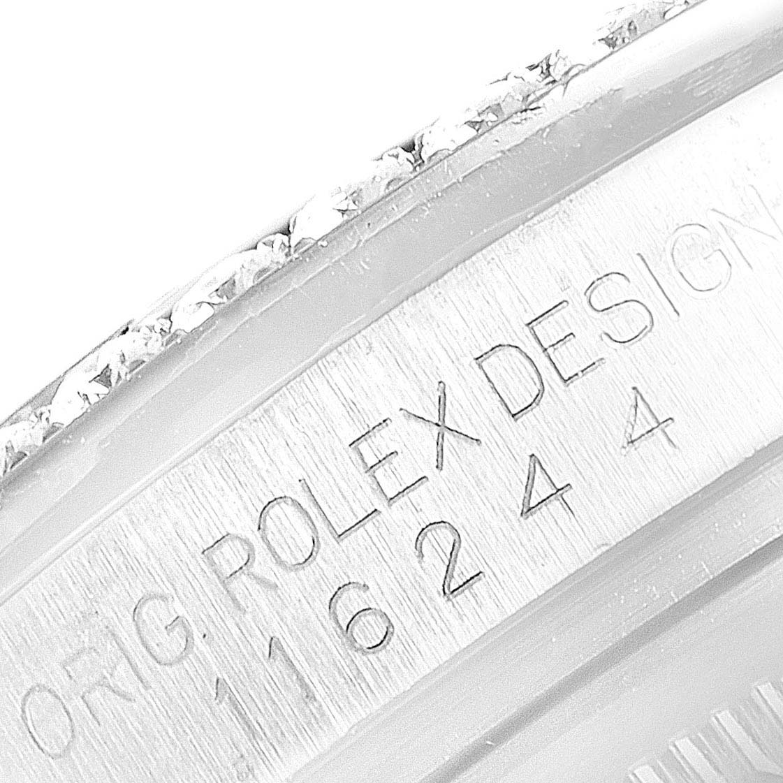 This image shows a close-up of the side engraving and bezel of a Rolex Datejust 116244 Men's Stainless Steel Mother of Pearl Dial 116244 Men's Stainless Steel Mother of Pearl Dial watch showing its design and model number.