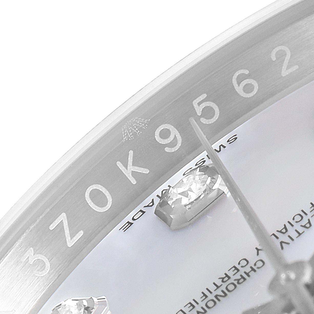 This close-up image of a Rolex Datejust 116244 Men's Stainless Steel Mother of Pearl Dial 116244 Men's Stainless Steel Mother of Pearl Dial watch shows part of the bezel, dial, and a diamond hour marker.