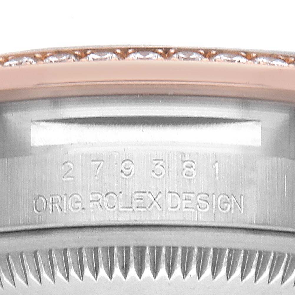The image shows a close-up of the Rolex Datejust 279381 Women's Steel and Gold (two tone) Brown Dial 279381 Women's Steel and Gold (two tone) Brown Dial model's engraved case side, including serial numbers and the "Orig. Rolex Design" inscription.