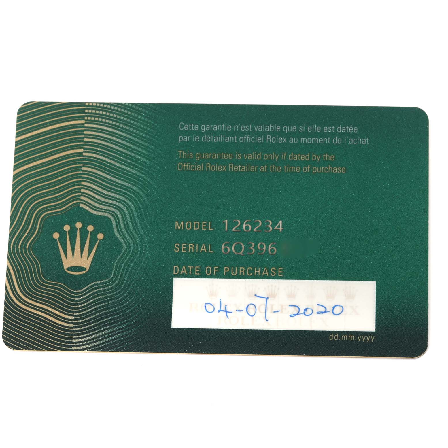This image shows a green warranty card for the Rolex Datejust 126234 Men's Stainless Steel Blue Dial 126234 Men's Stainless Steel Blue Dial model 126234, with the serial number and purchase date visible.