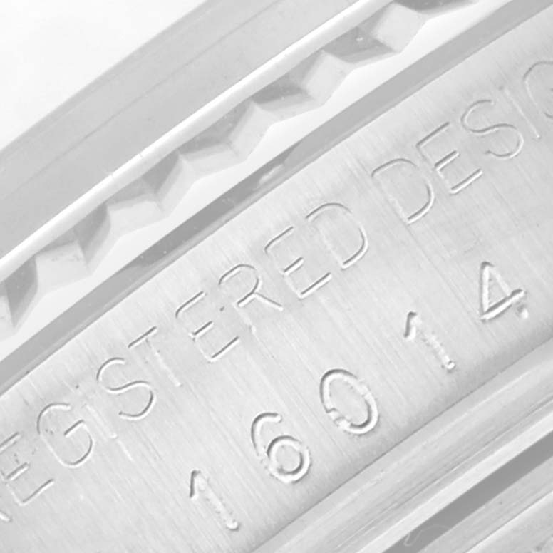 This image shows a close-up of the engraved serial number and part of the bezel of the Vintage Collection model by Rolex.