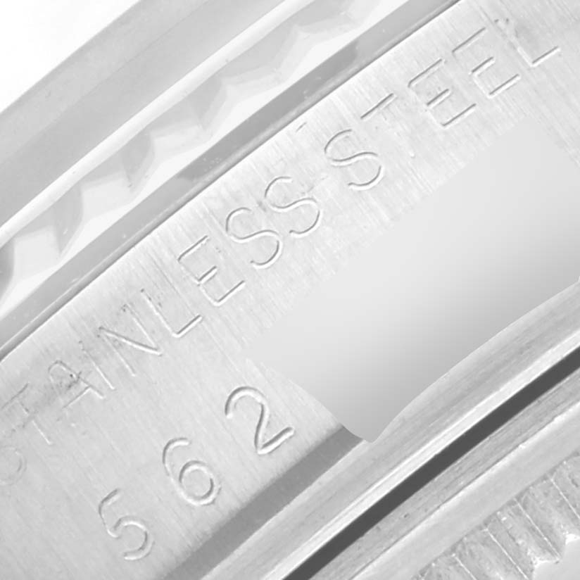 The image shows a close-up of the Rolex Vintage Collection 16014 Men's Stainless Steel Silver Dial 16014 Men's Stainless Steel Silver Dial watch's stainless steel case side with engraved text.