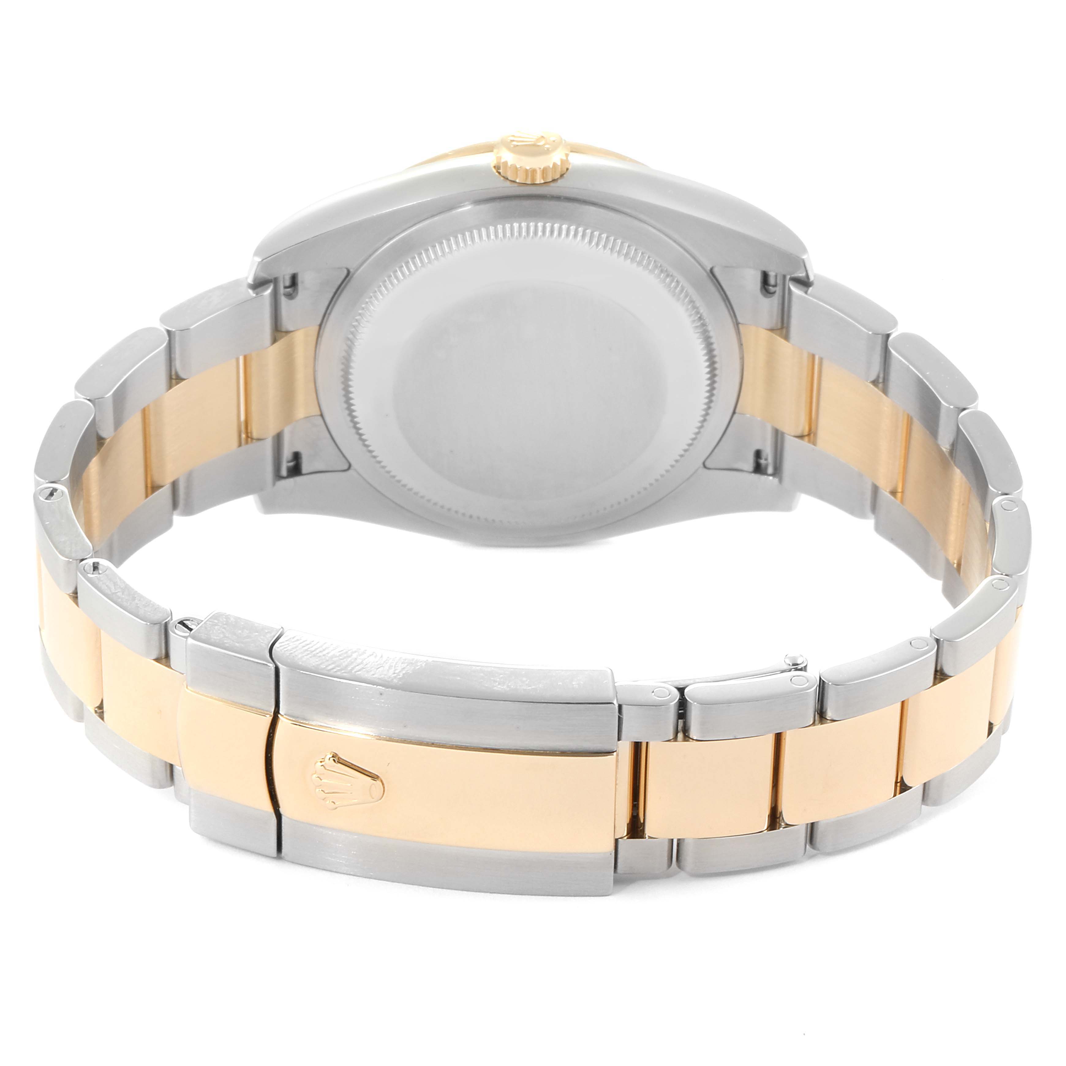 The image shows the back and bracelet of a Rolex Datejust 116243 Men
s Steel and Gold (two tone) Mother of Pearl Dial 116243 Men
s Steel and Gold (two tone) Mother of Pearl Dial watch, highlighting its two-tone metal design and clasp.